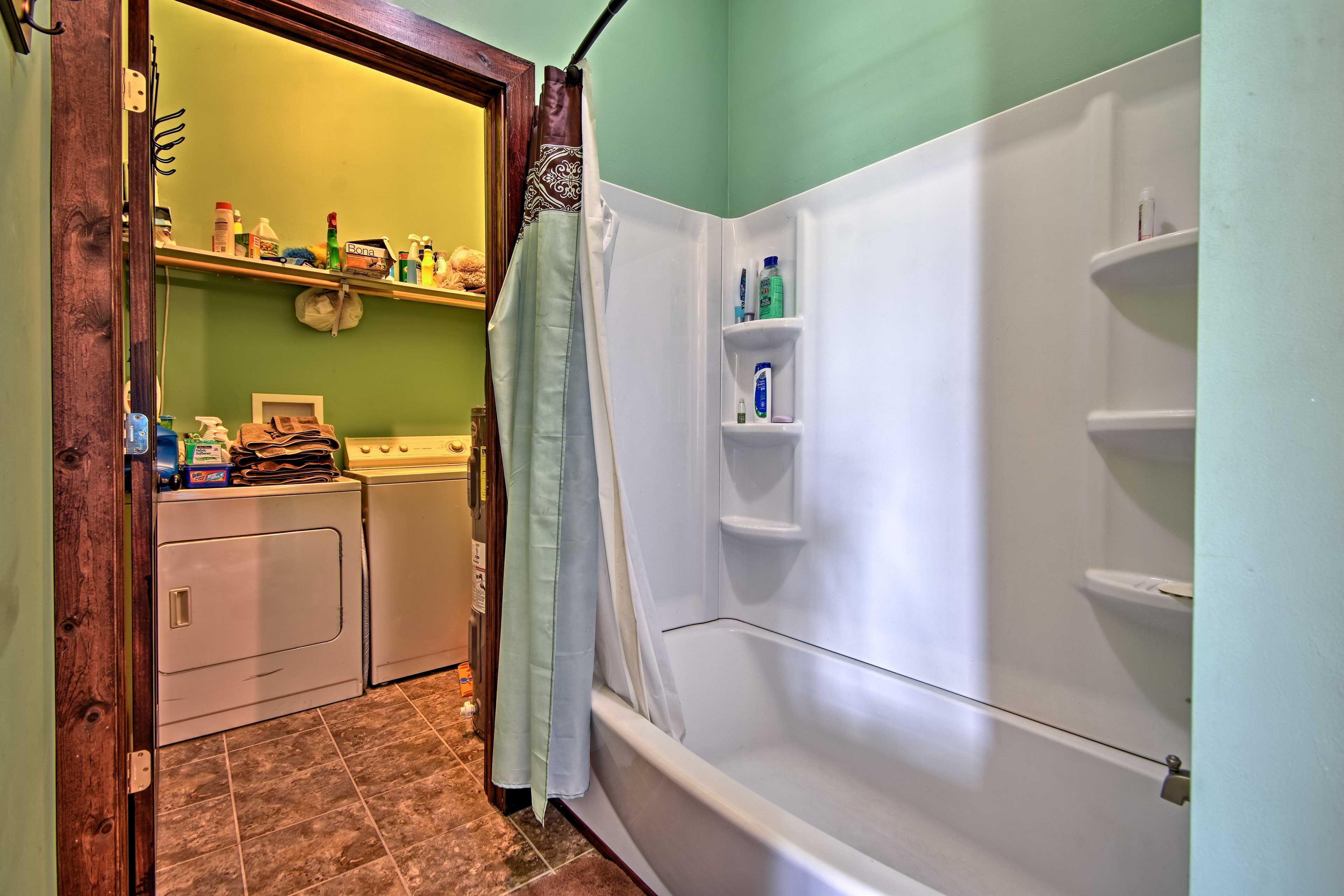 There's a laundry room adjacent to the full bathroom.