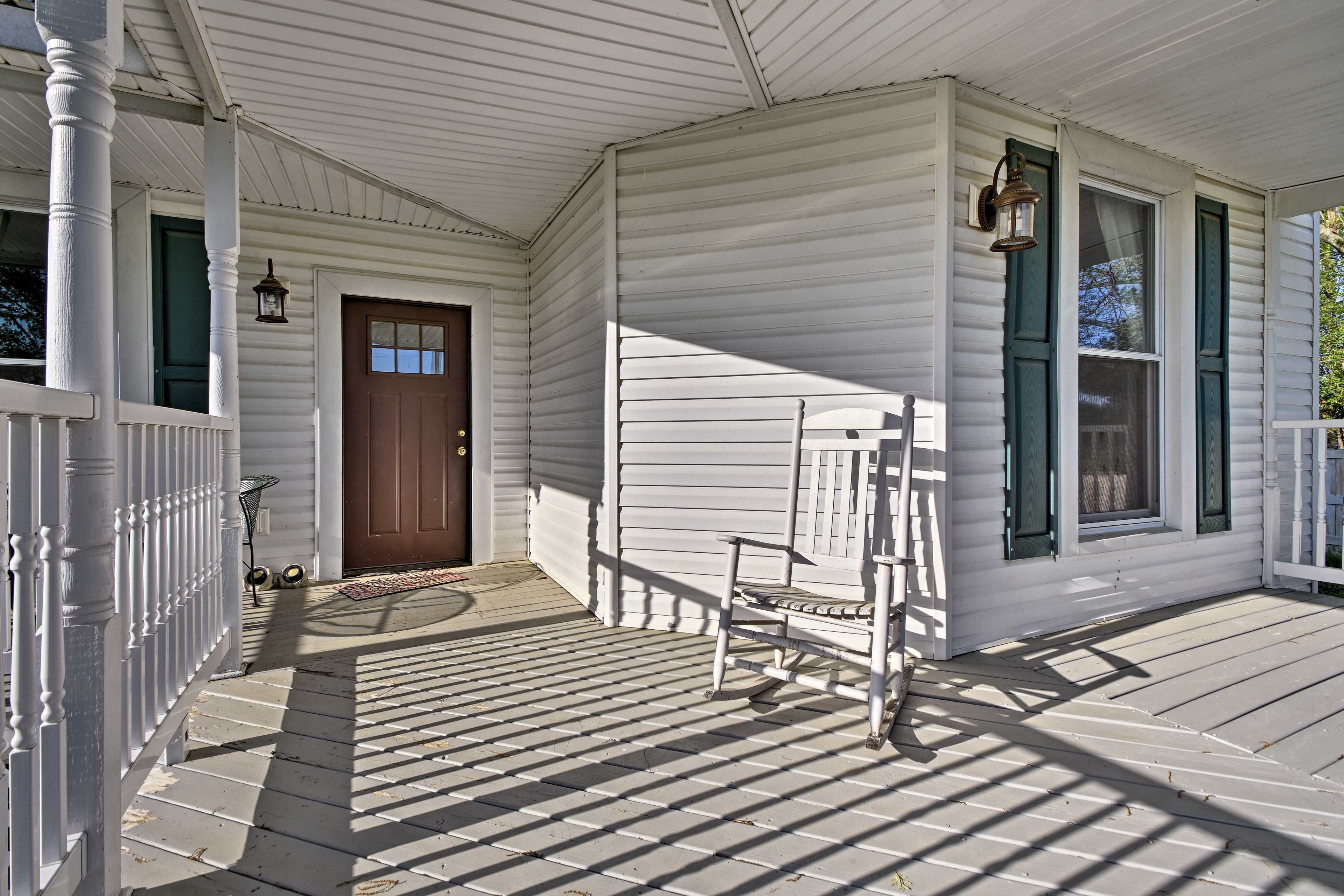 Step out to the massive porch to get some fresh air.