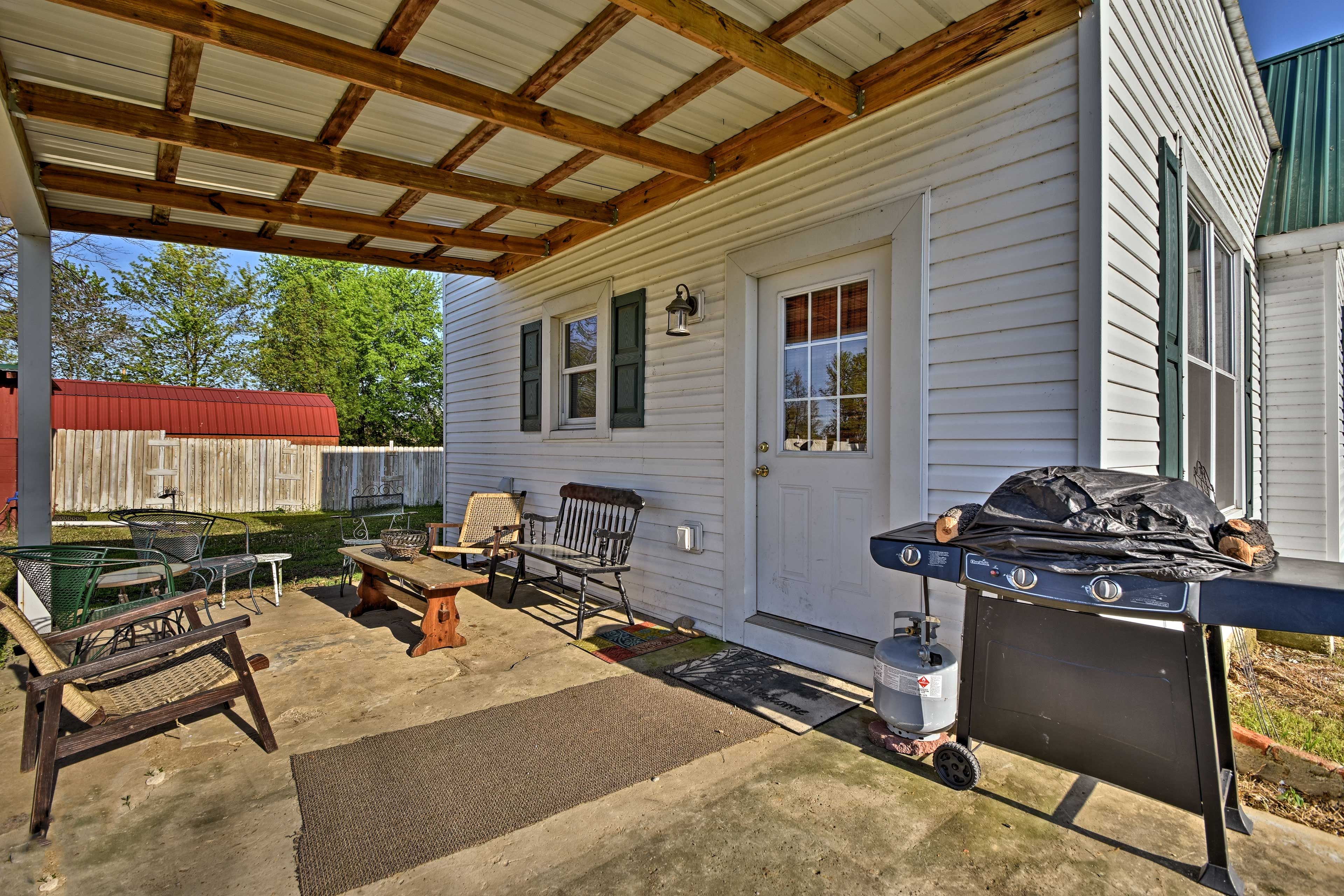 Out back, you'll find a gas grill and another sitting area.