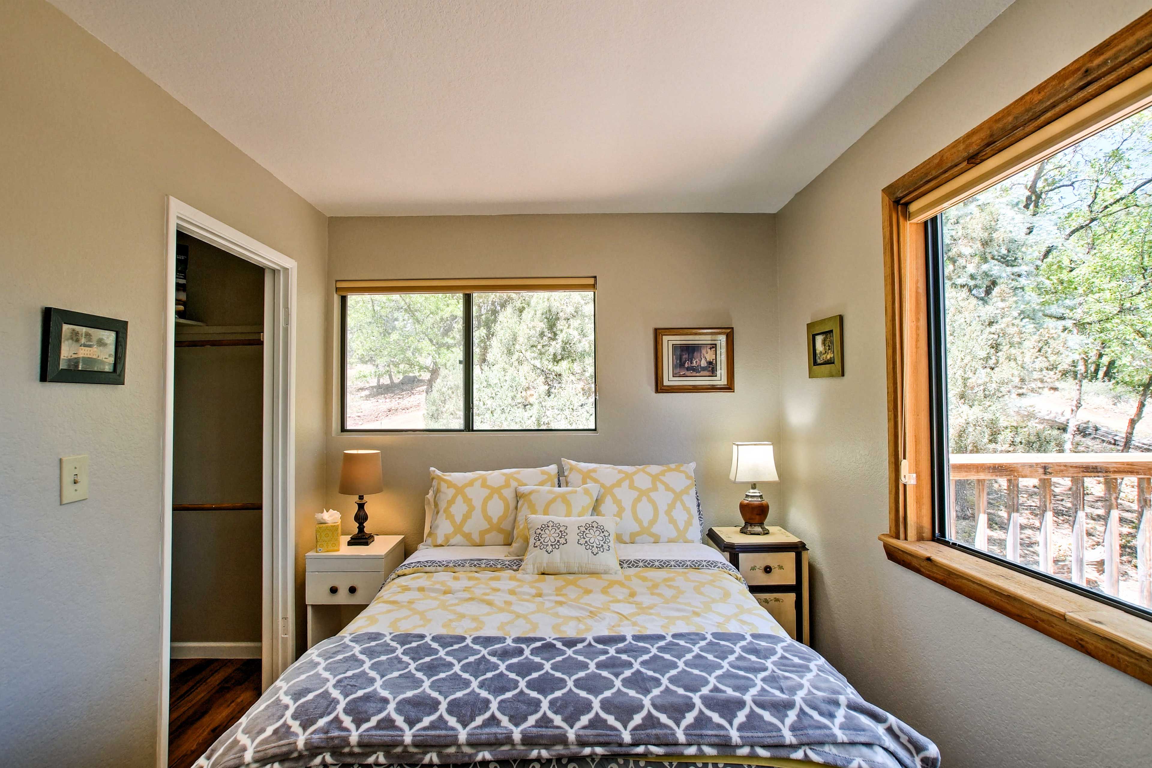 Wake to natural light and wooded views filtering through the window.