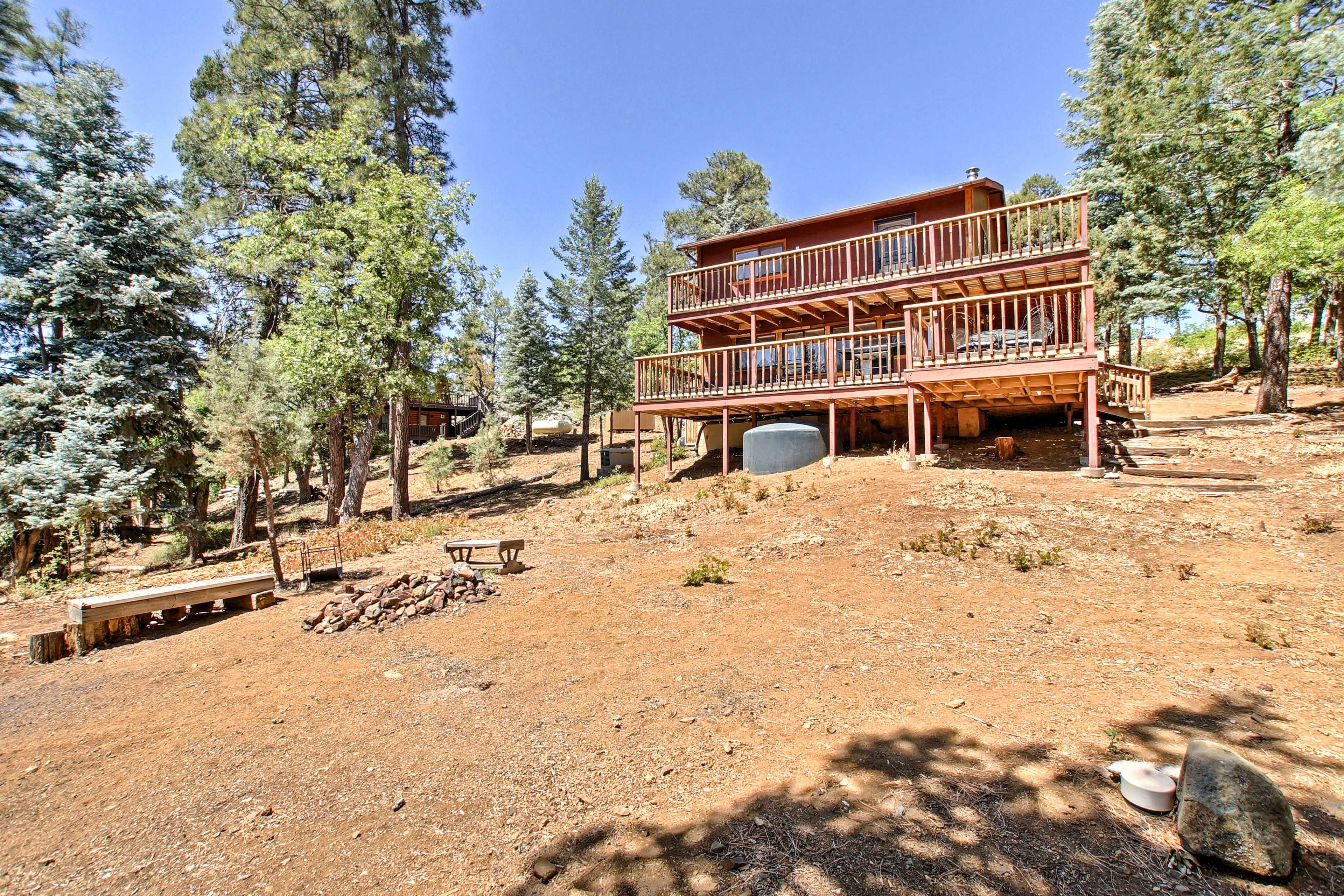 The backyard boasts a fire pit and horseshoes!