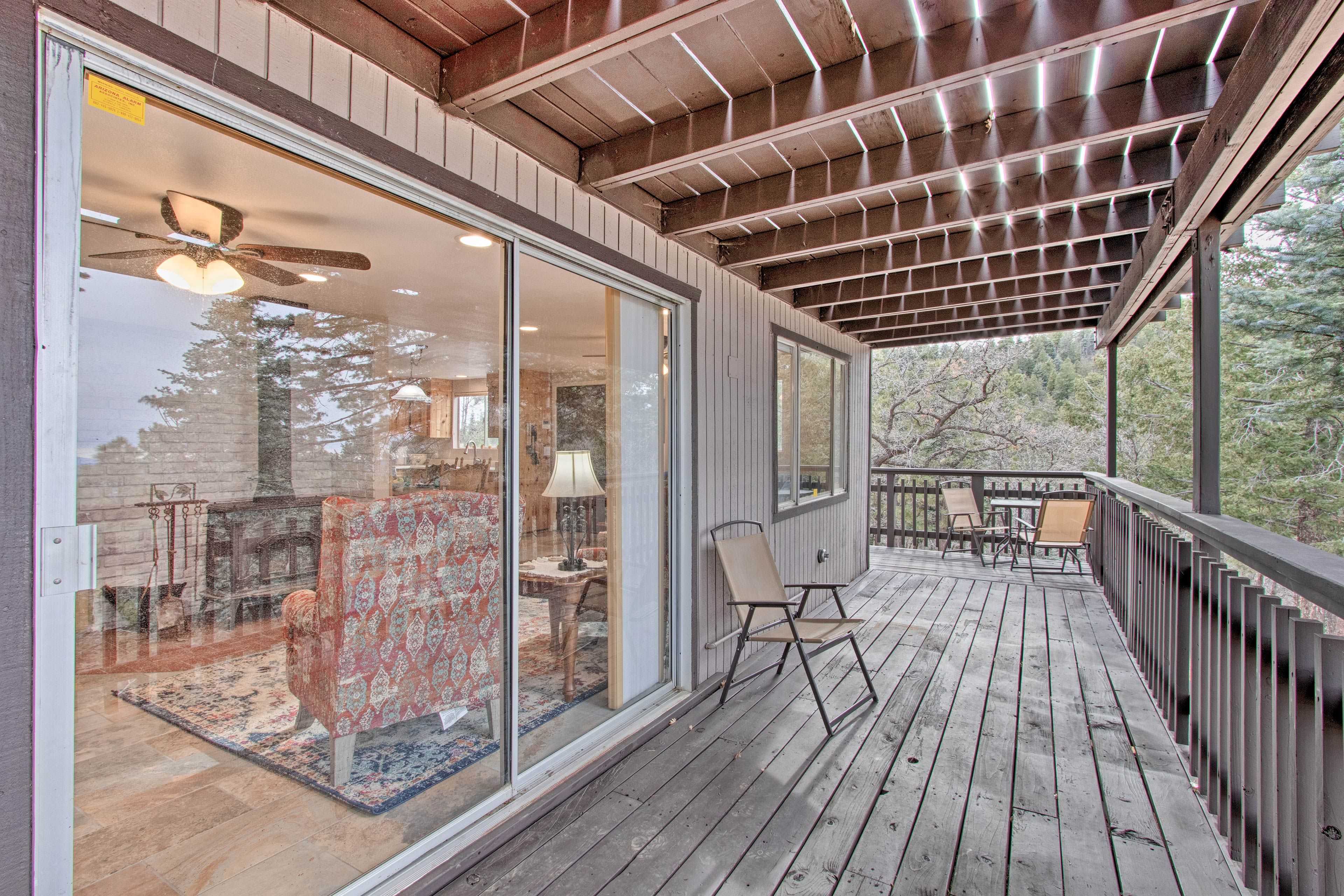 Breathe in that fresh pine-scented air on the covered deck.
