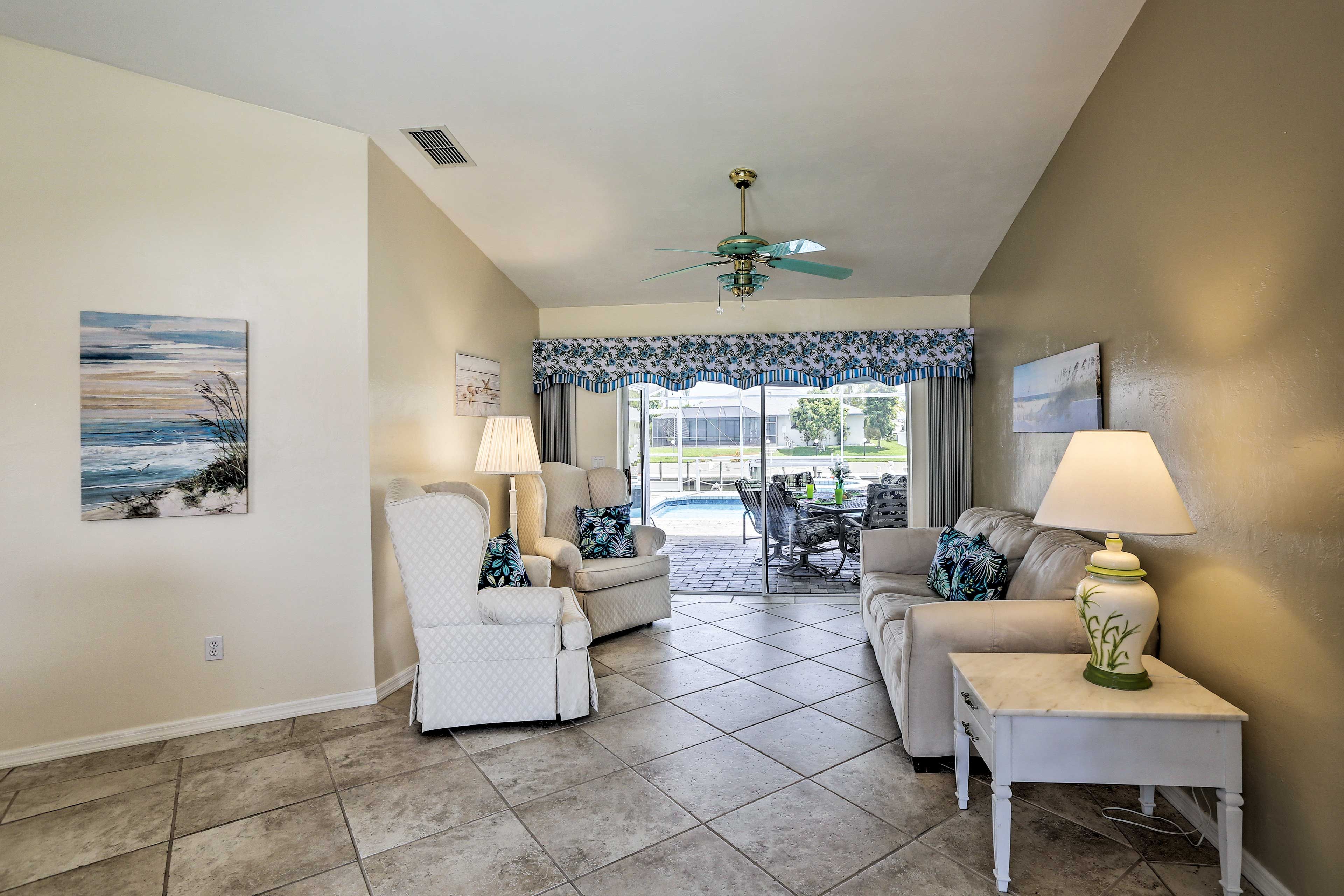 Cozy up with a book in the bright living room and unwind in comfort.