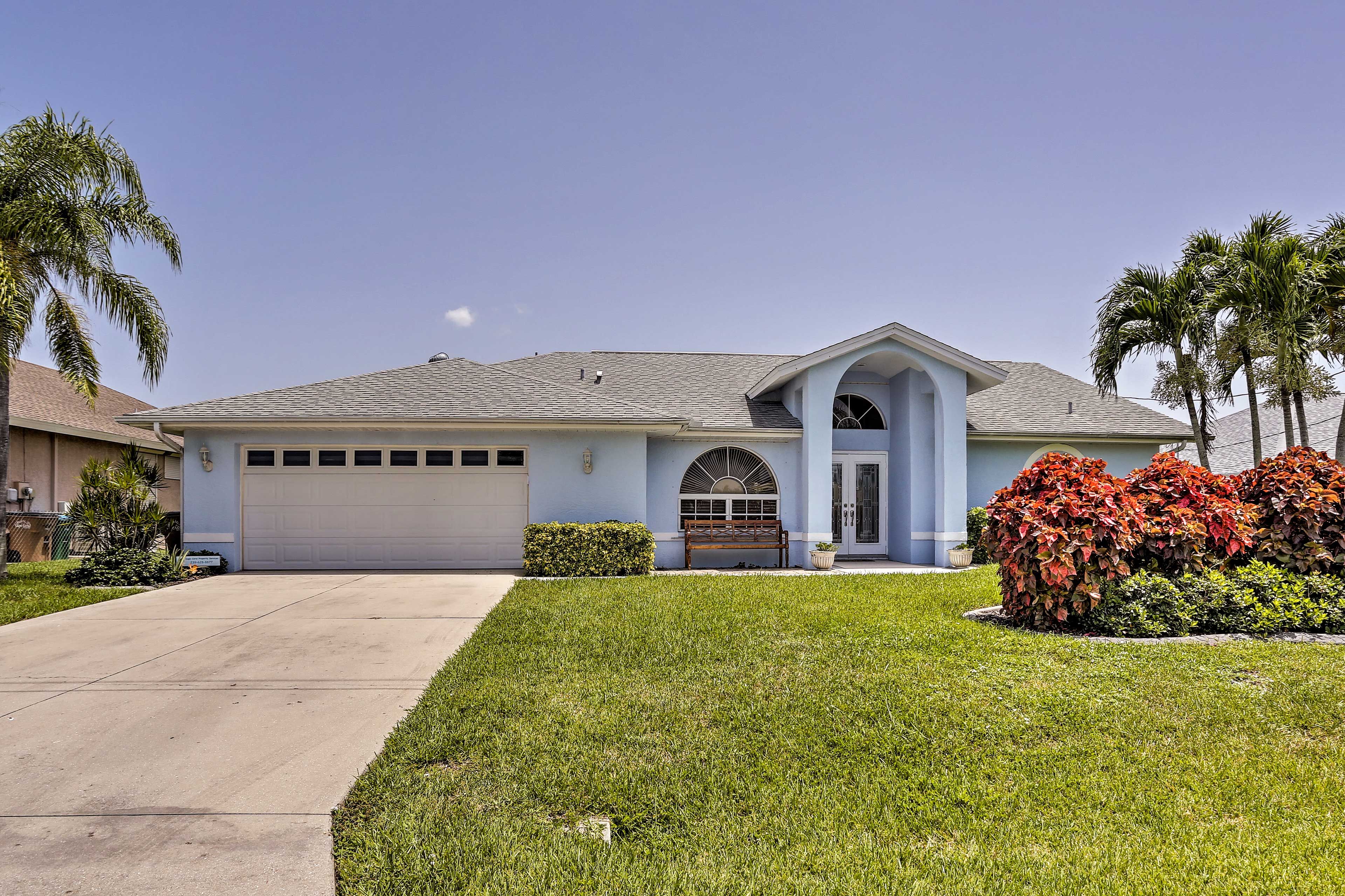 Park 2 cars in the garage and 4 more in the driveway of this Cape Coral home.