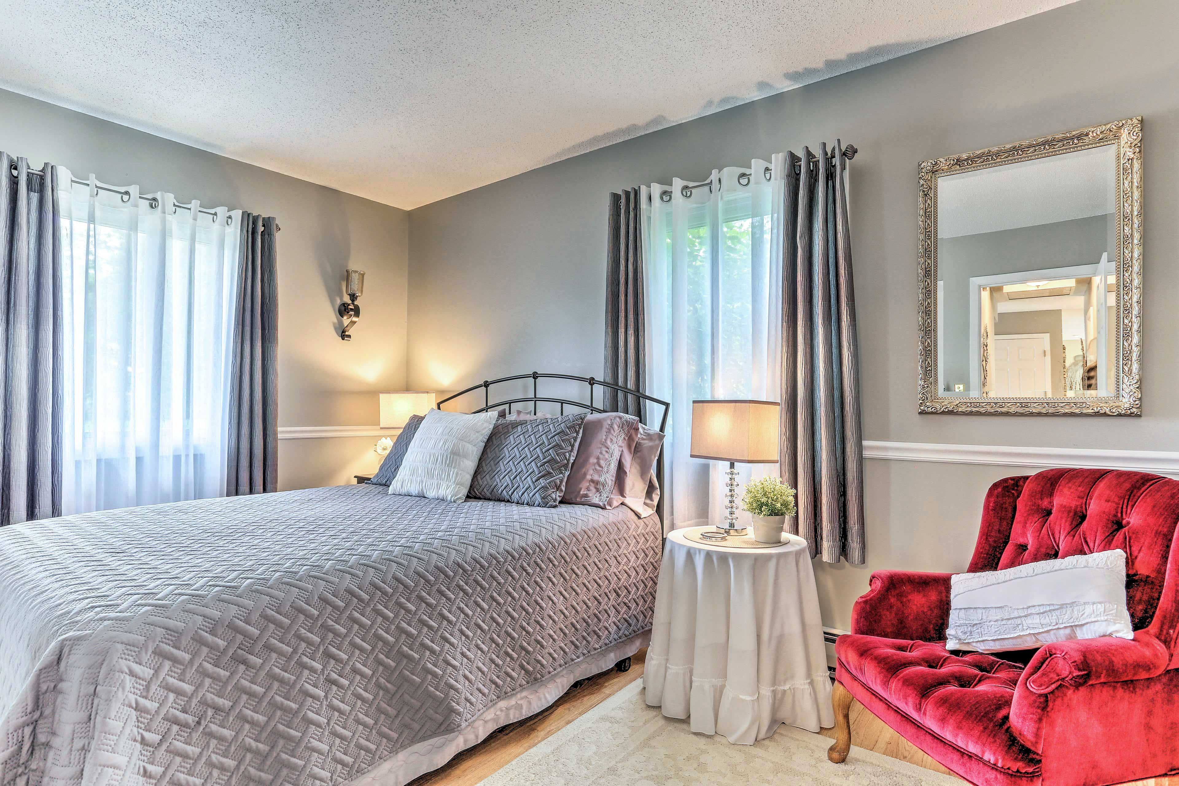 A queen bed highlights bedroom 2.