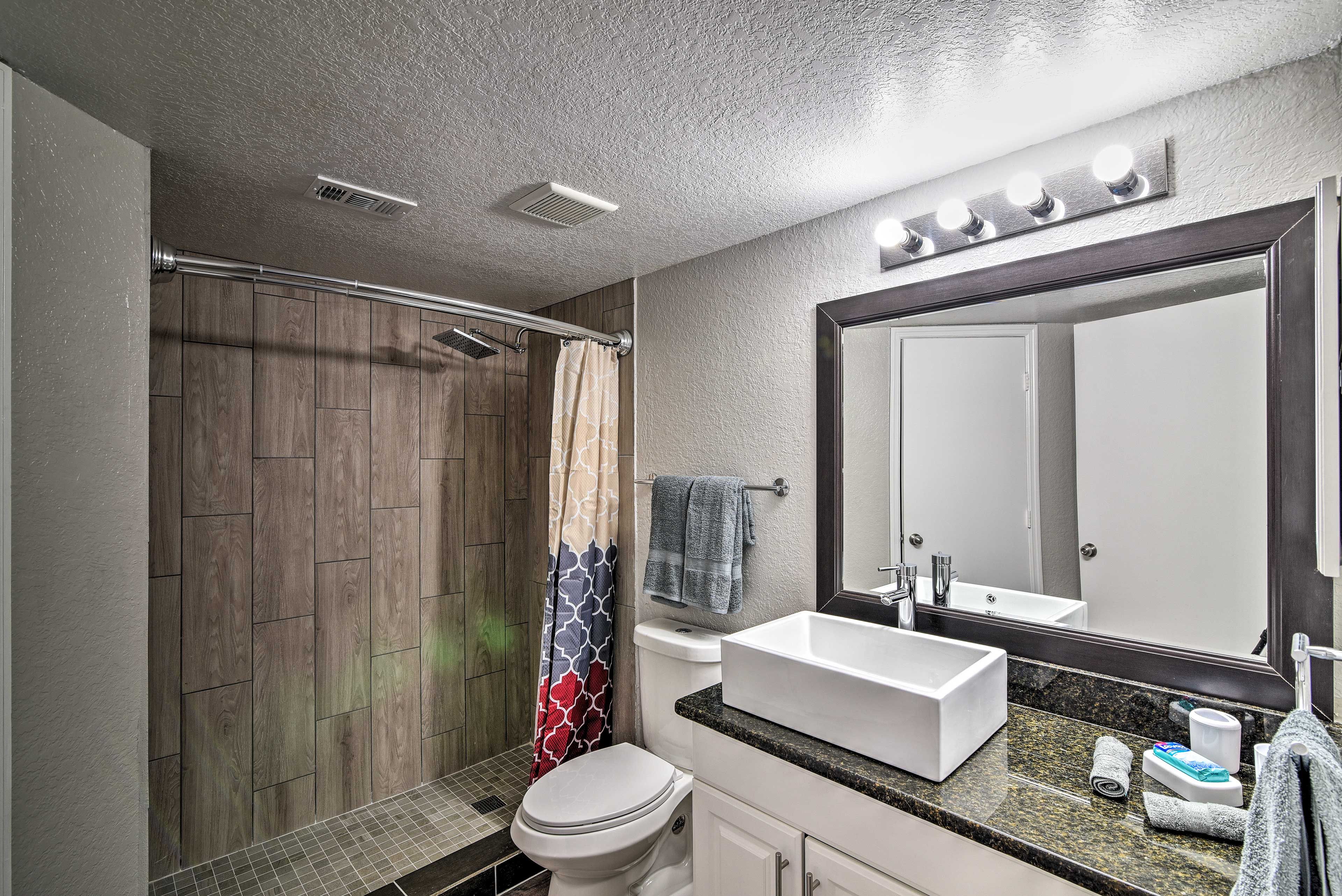 Two separate bathrooms offer privacy to refresh.