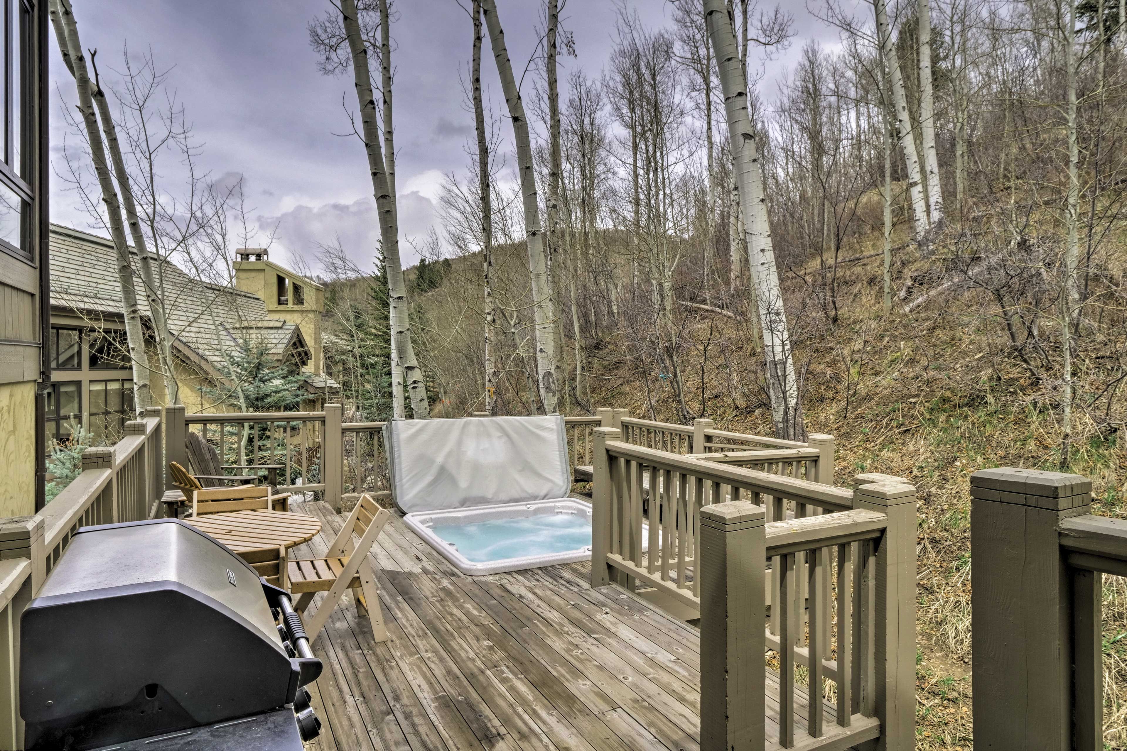 This beautiful home features a deck with a private hot tub.