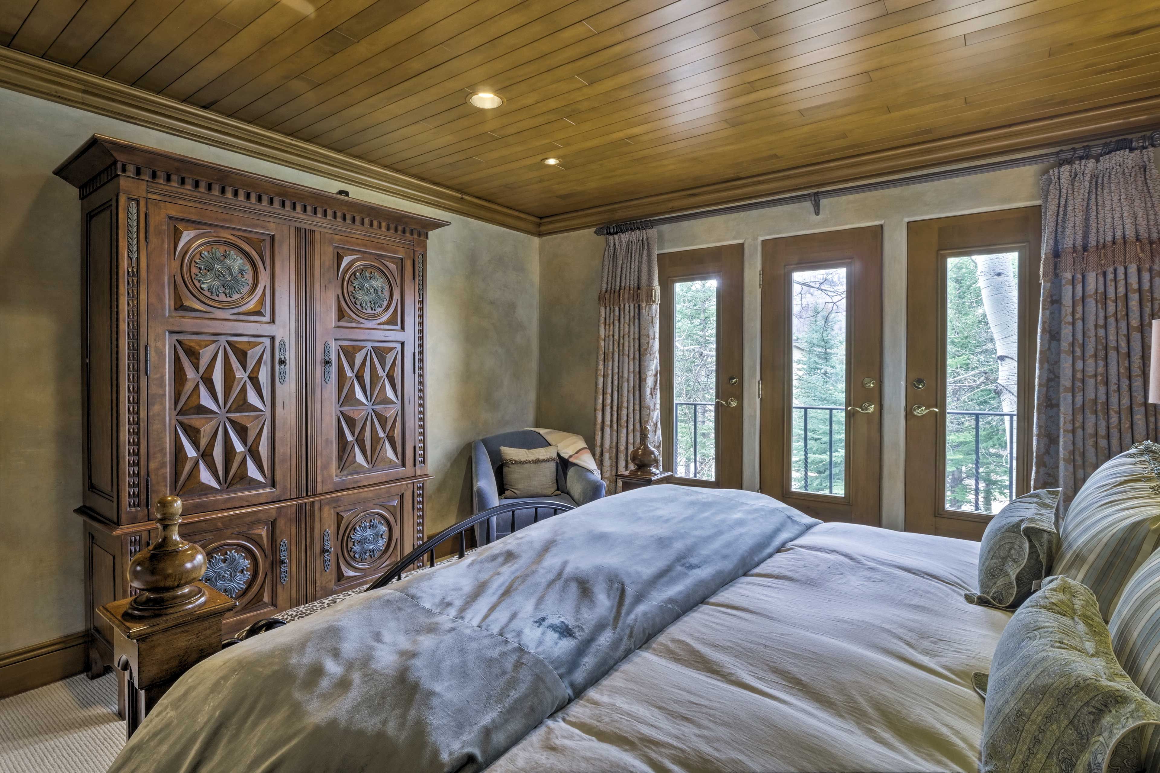 Access the balcony through this master bedroom.