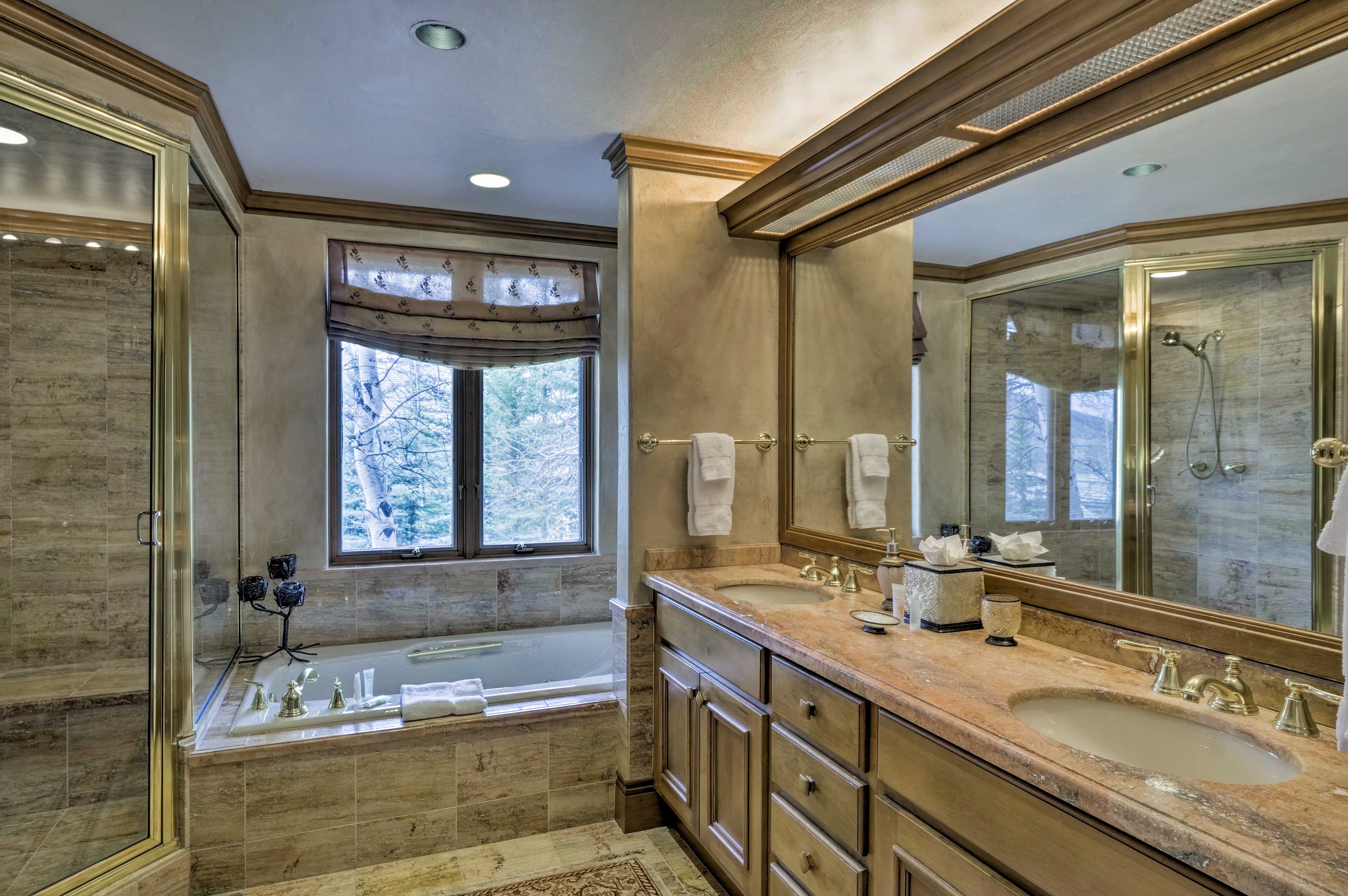 Rinse off in this pristine en-suite bathroom with separate shower and tub.