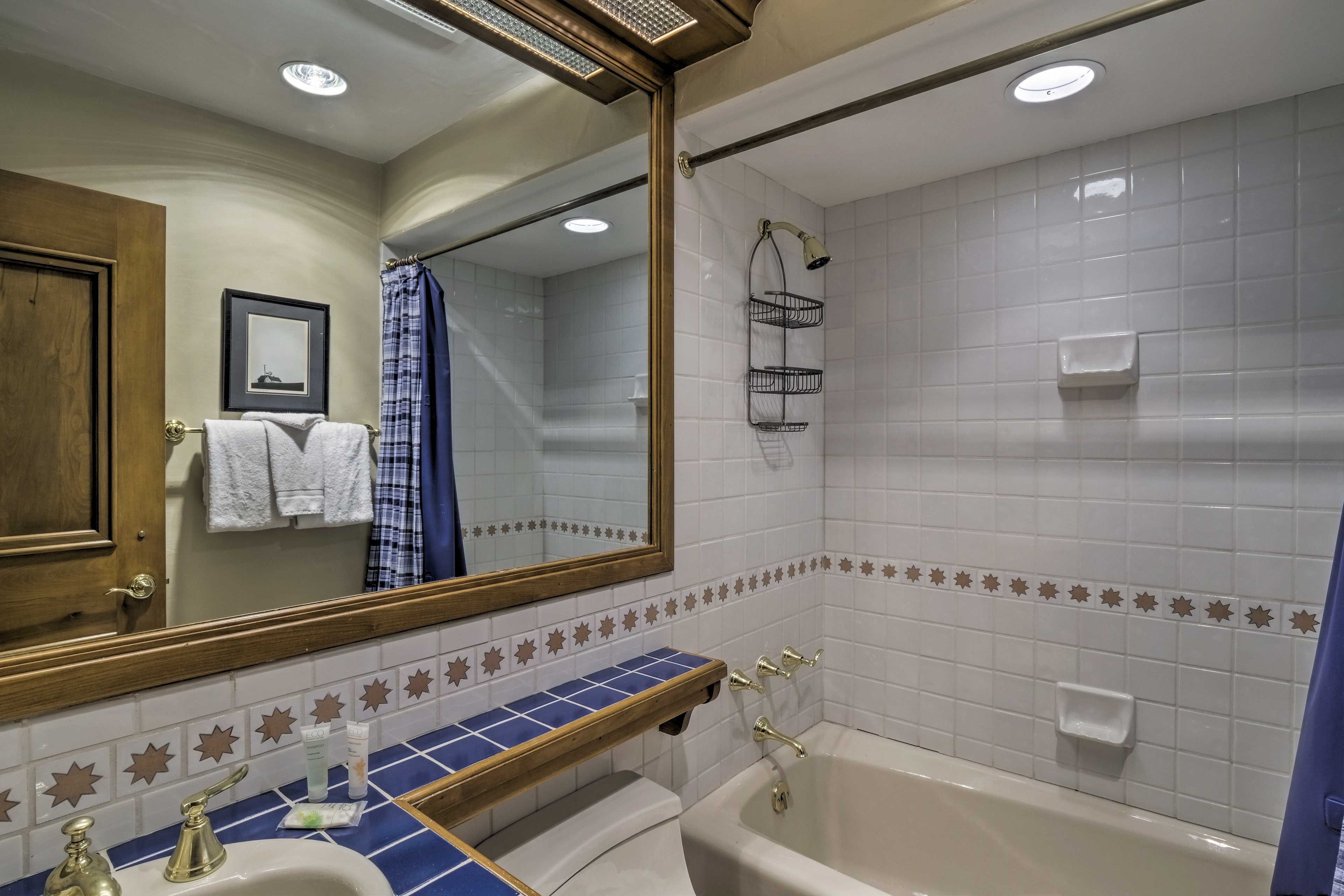 This bathroom offers a shower/tub combo.