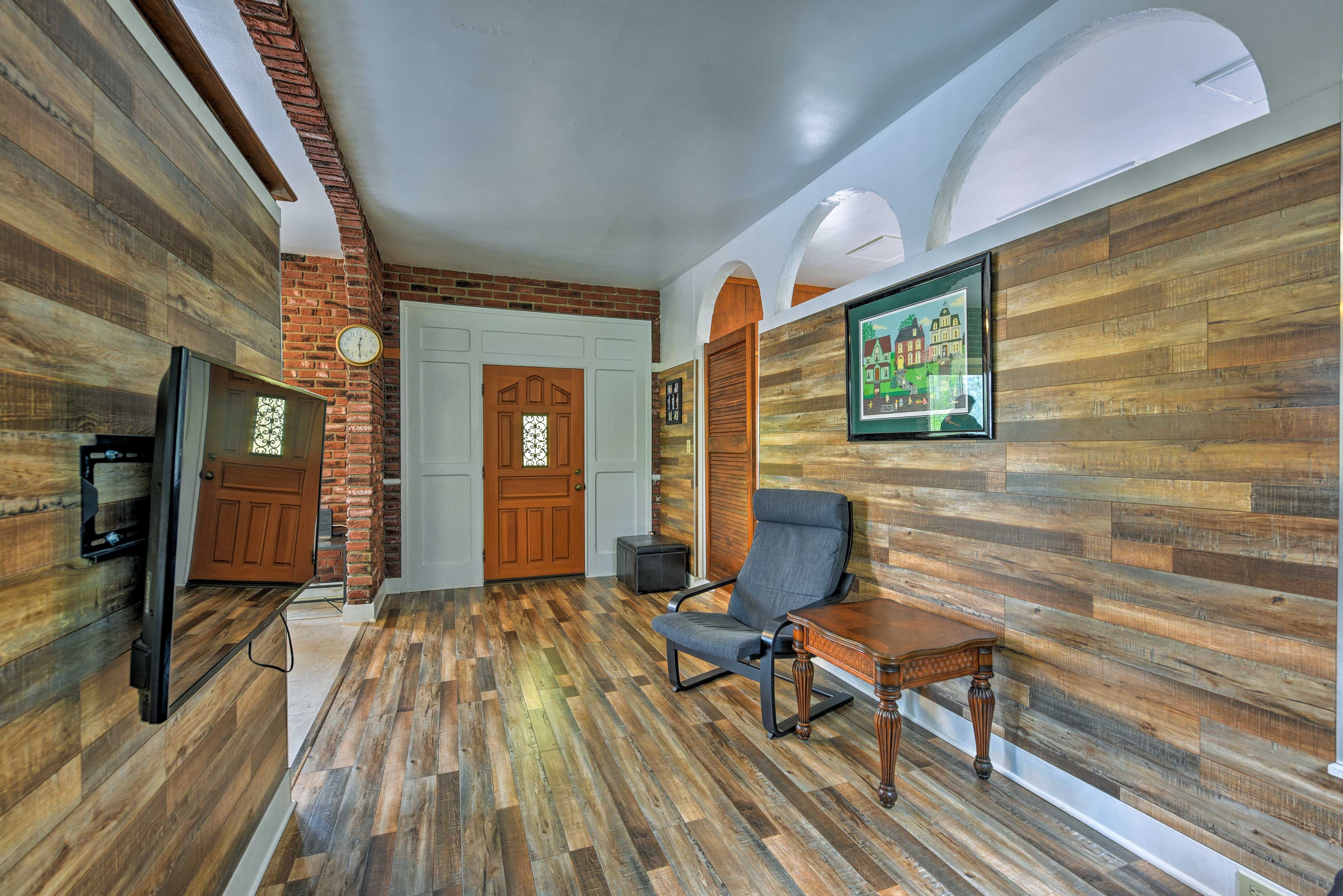 Modern updates such as wood paneling brighten the home.