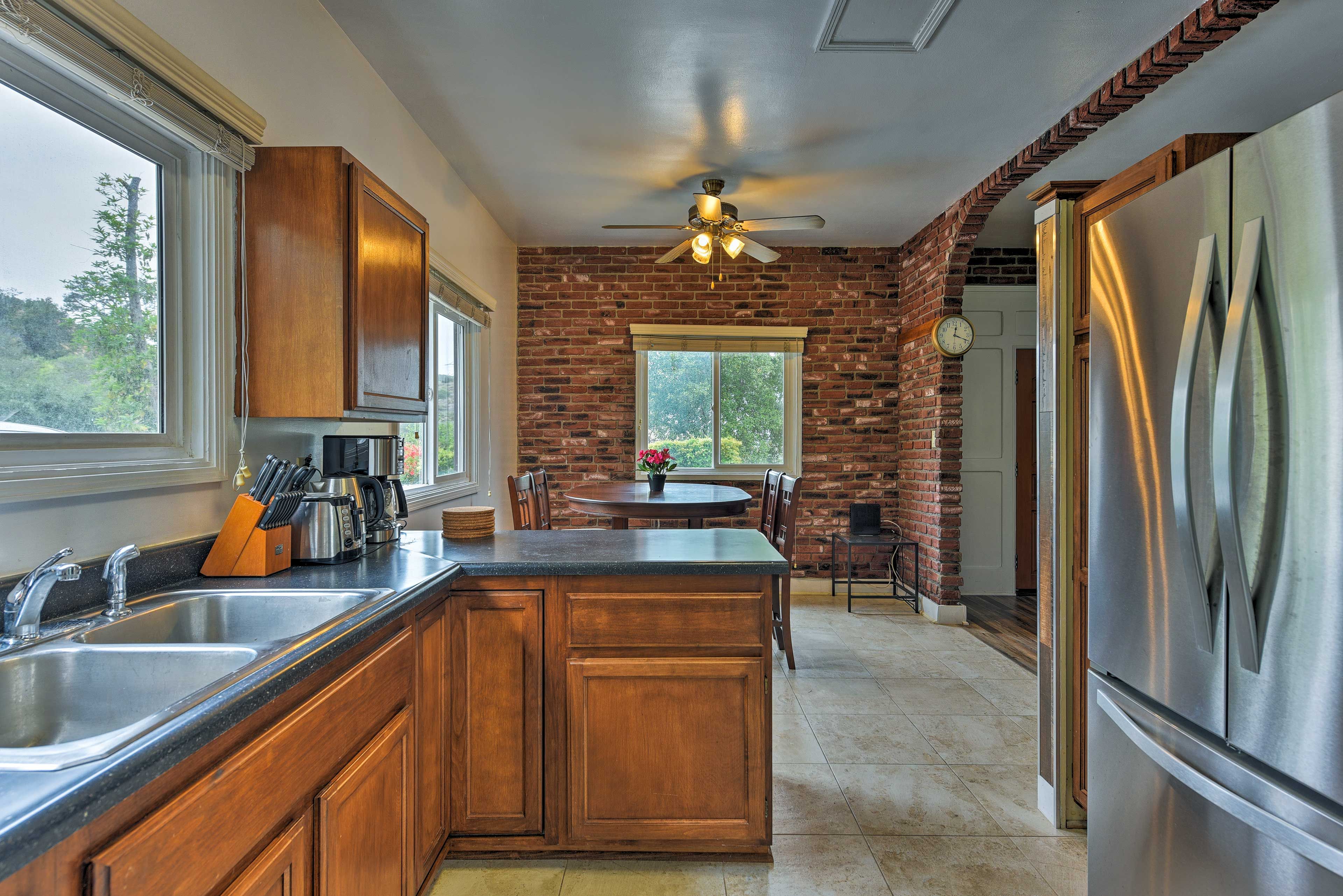 The kitchen features stainless steel appliances.