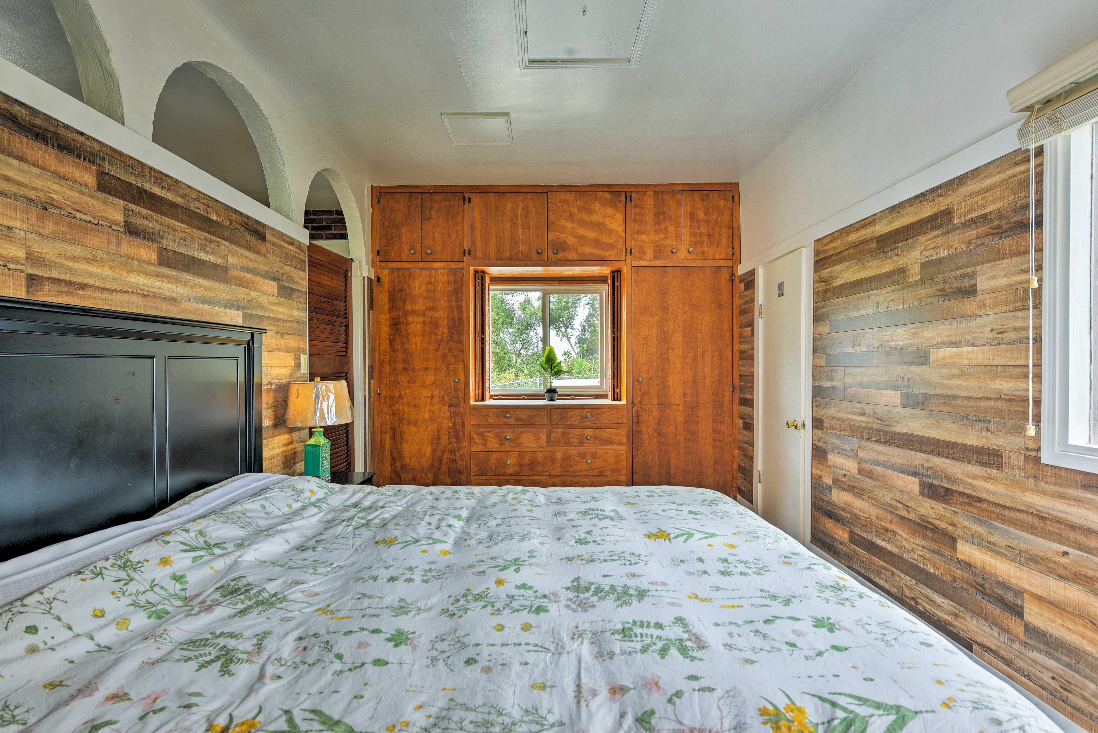 The wood paneling continues into the bedroom.