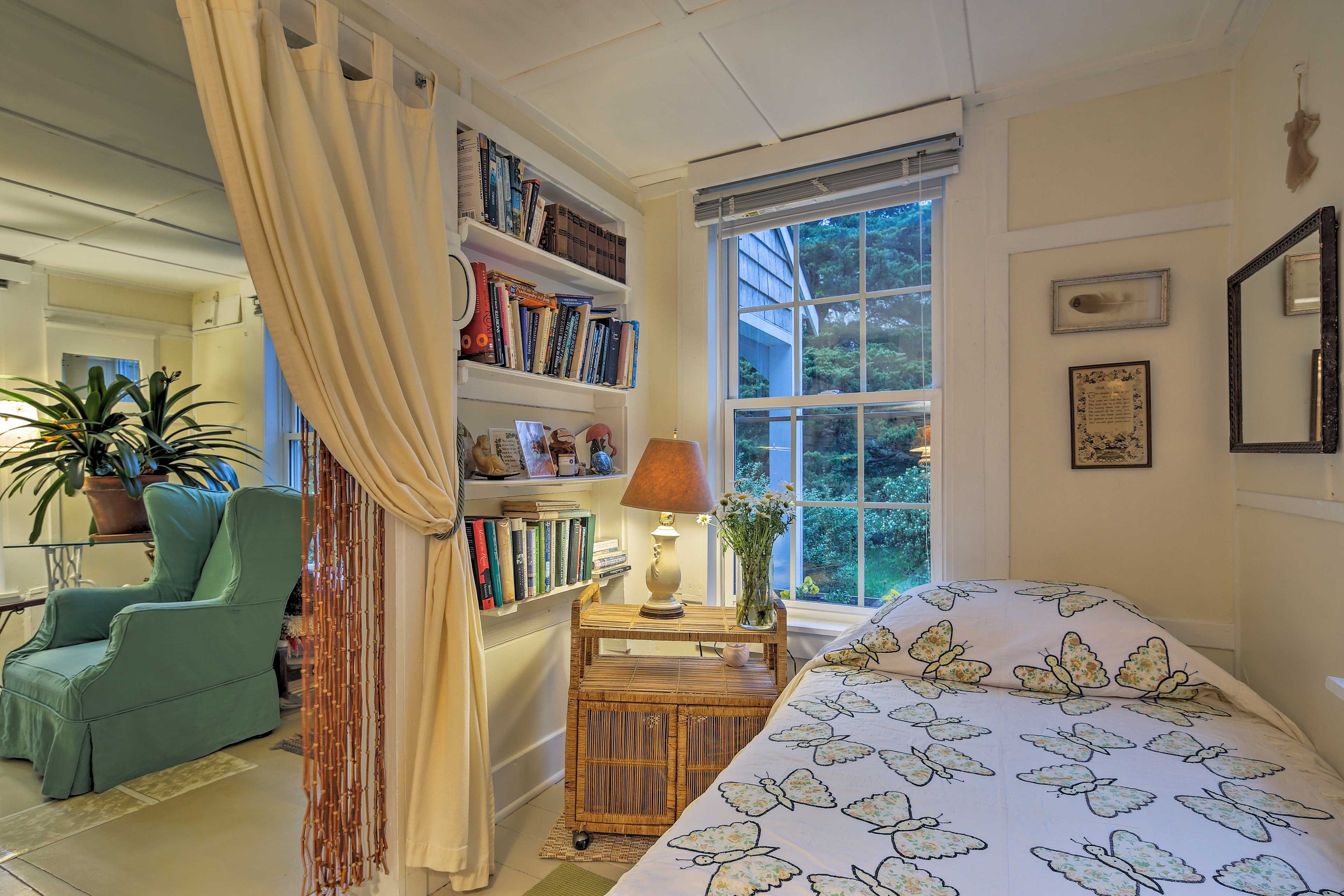 This twin bed sits just off of the living room.