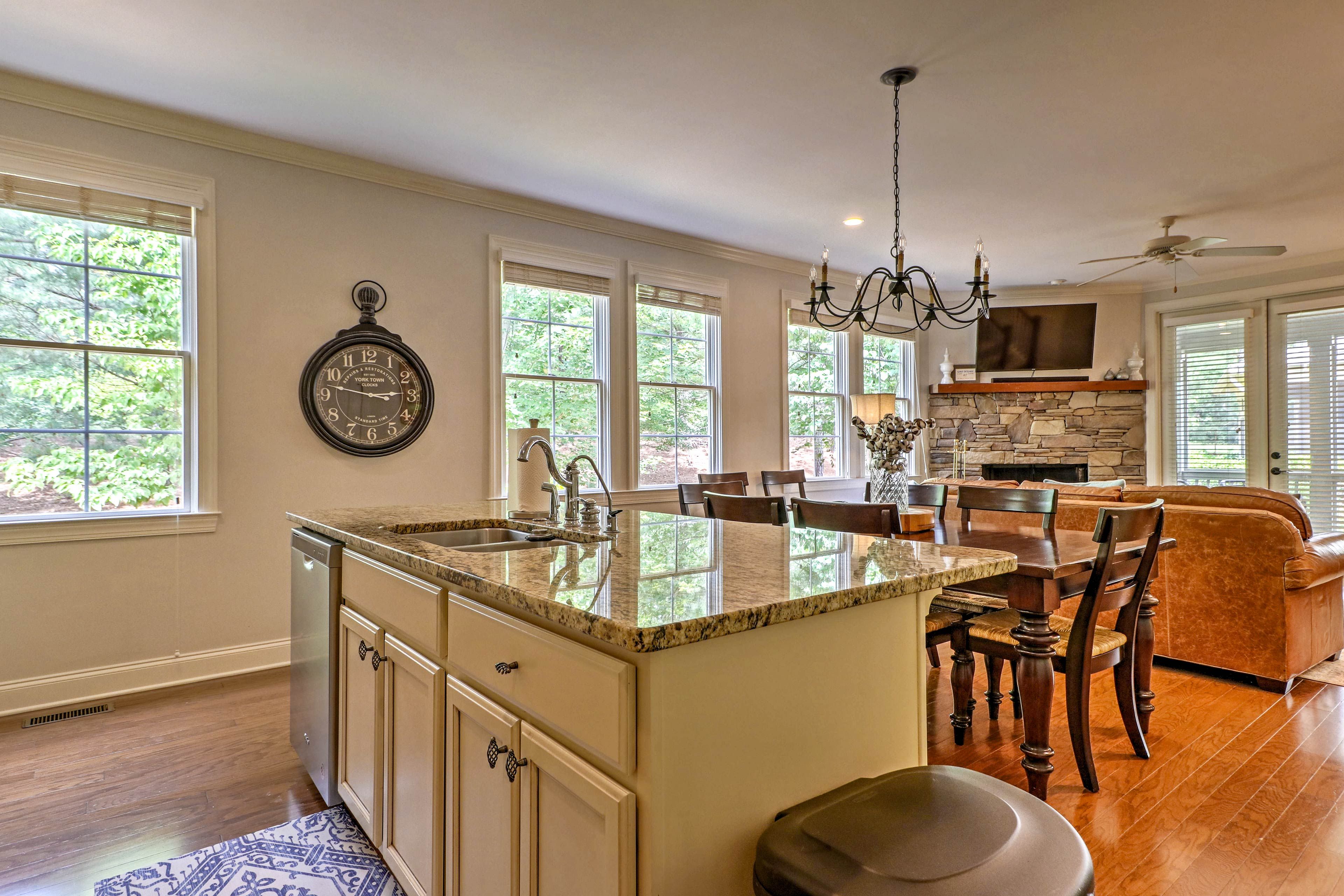 Granite counter tops embellish the kitchen and the center island.