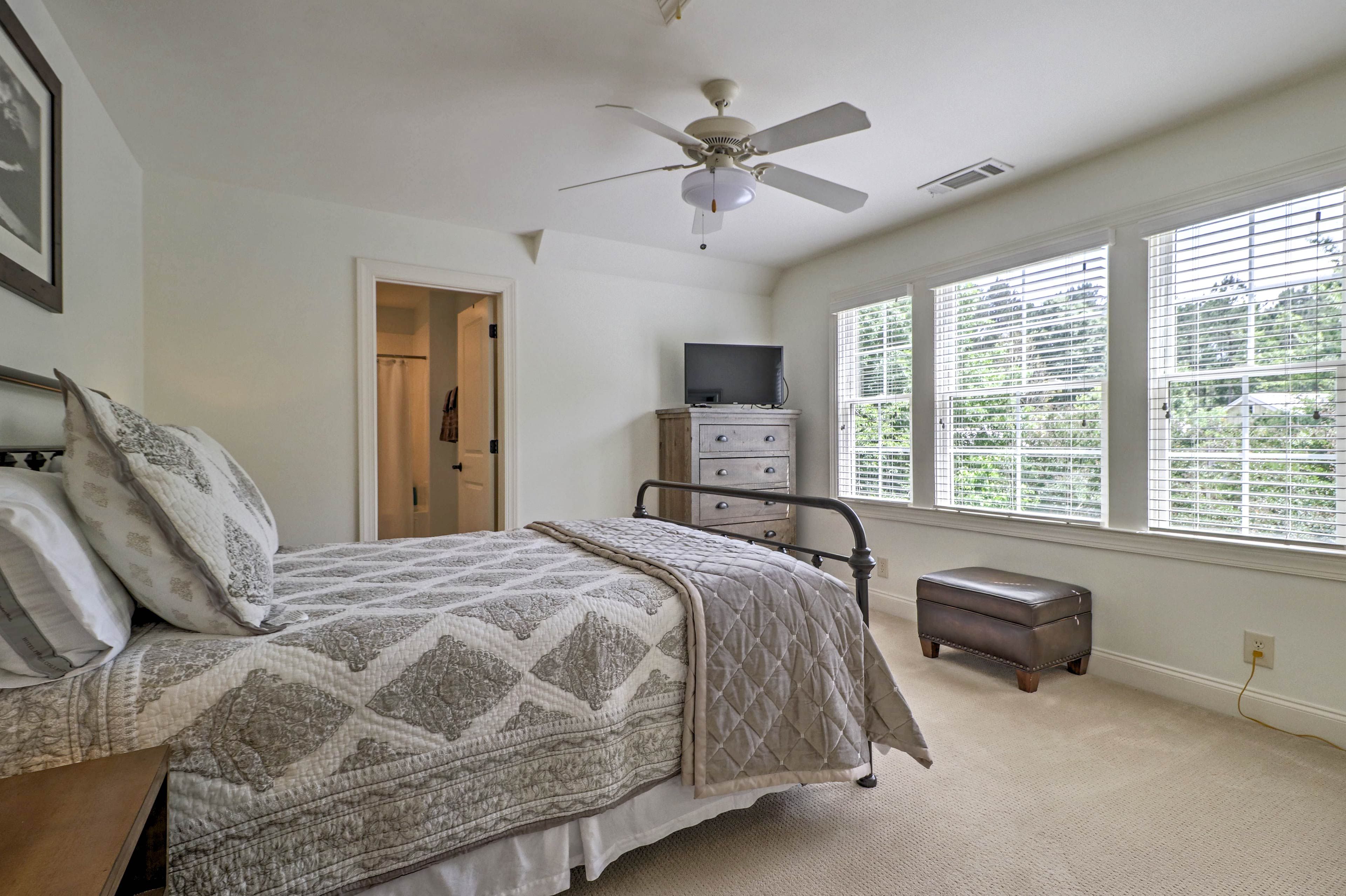 Each bedroom has a queen-sized bed and a flat-screen Smart TV.