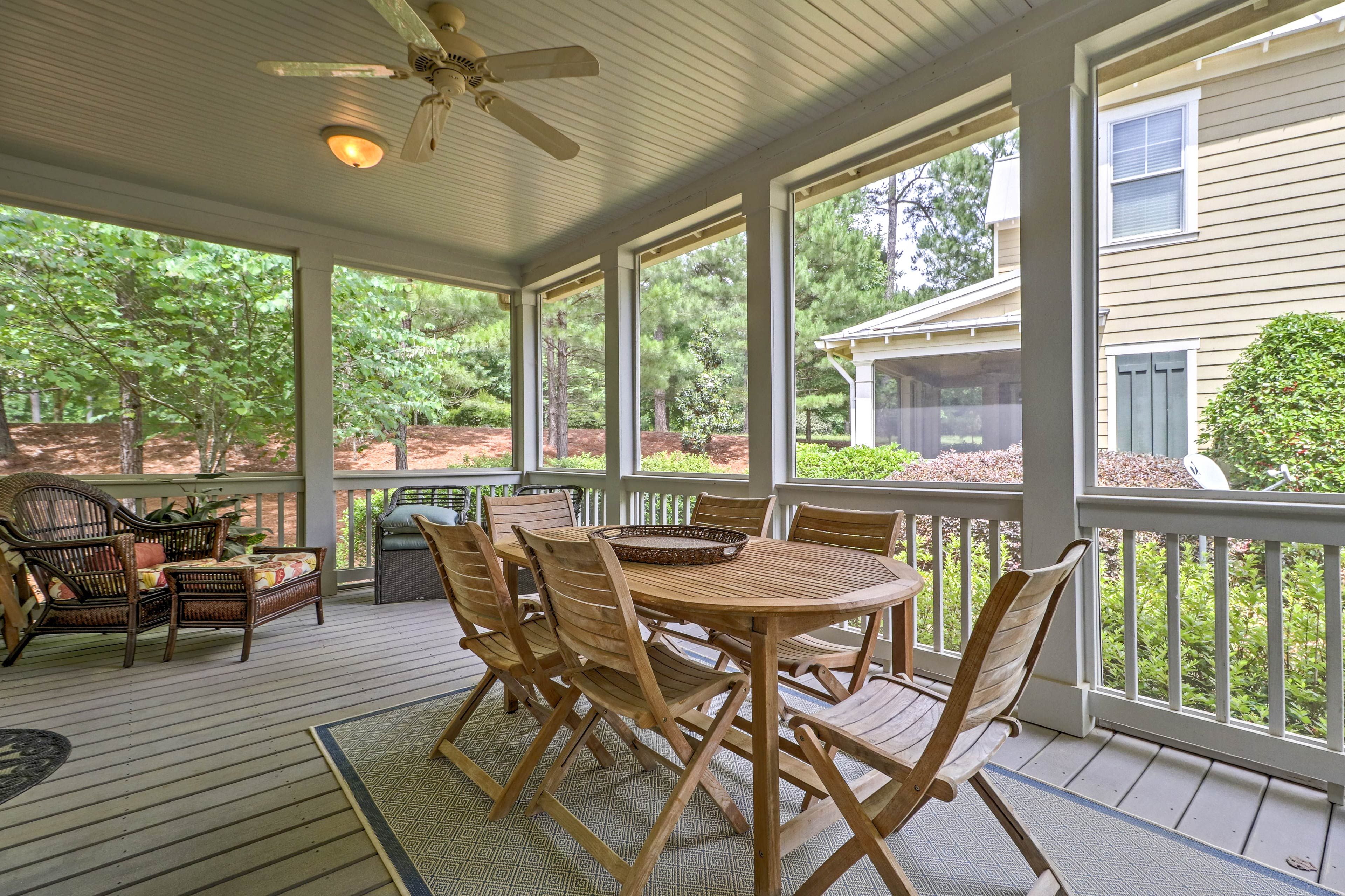 The large, furnished screened-in porch is an ideal dining and hangout spot.