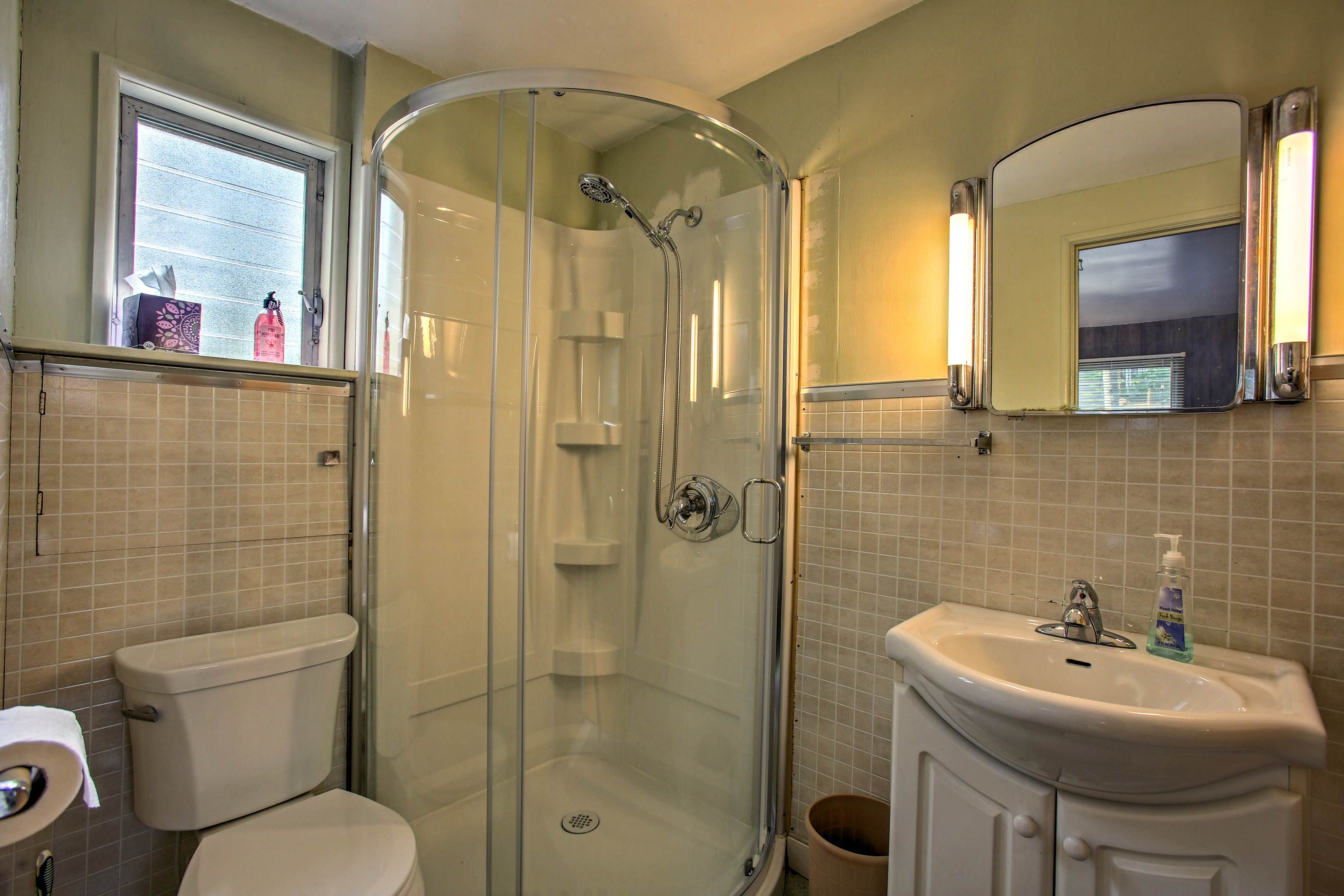After a day in the lake, shower off in the full bathroom stocked with towels.