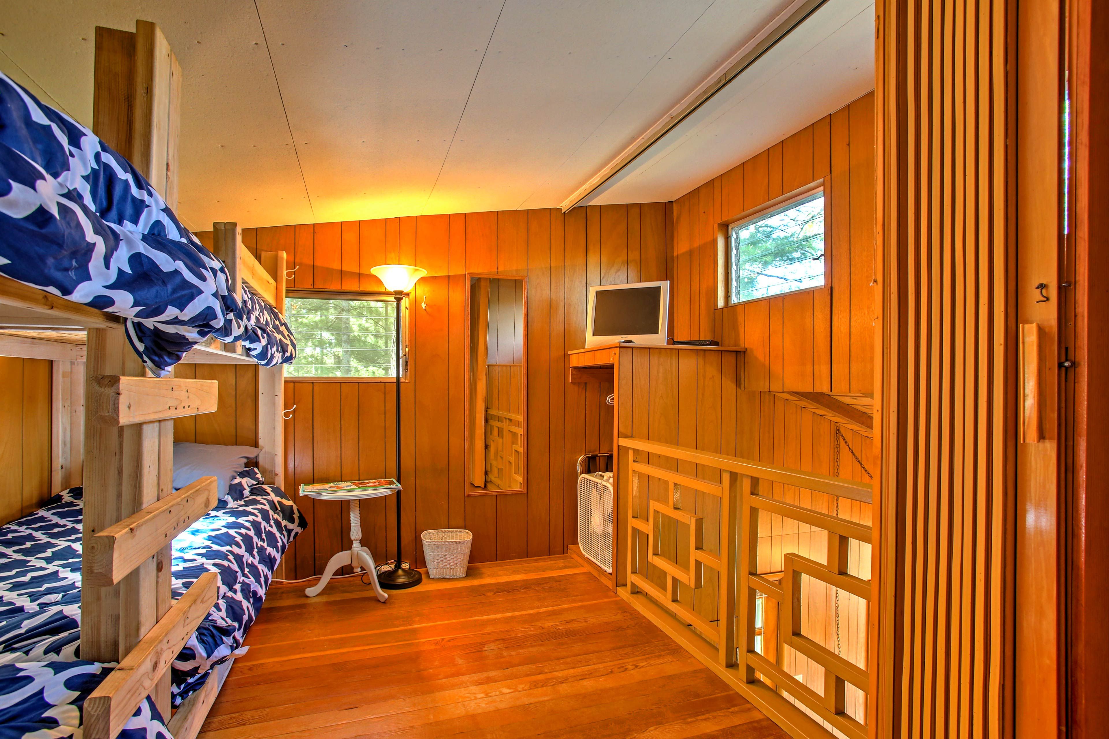 Tuck the kiddos into bed in the loft bedroom with 2 twin bunk beds.