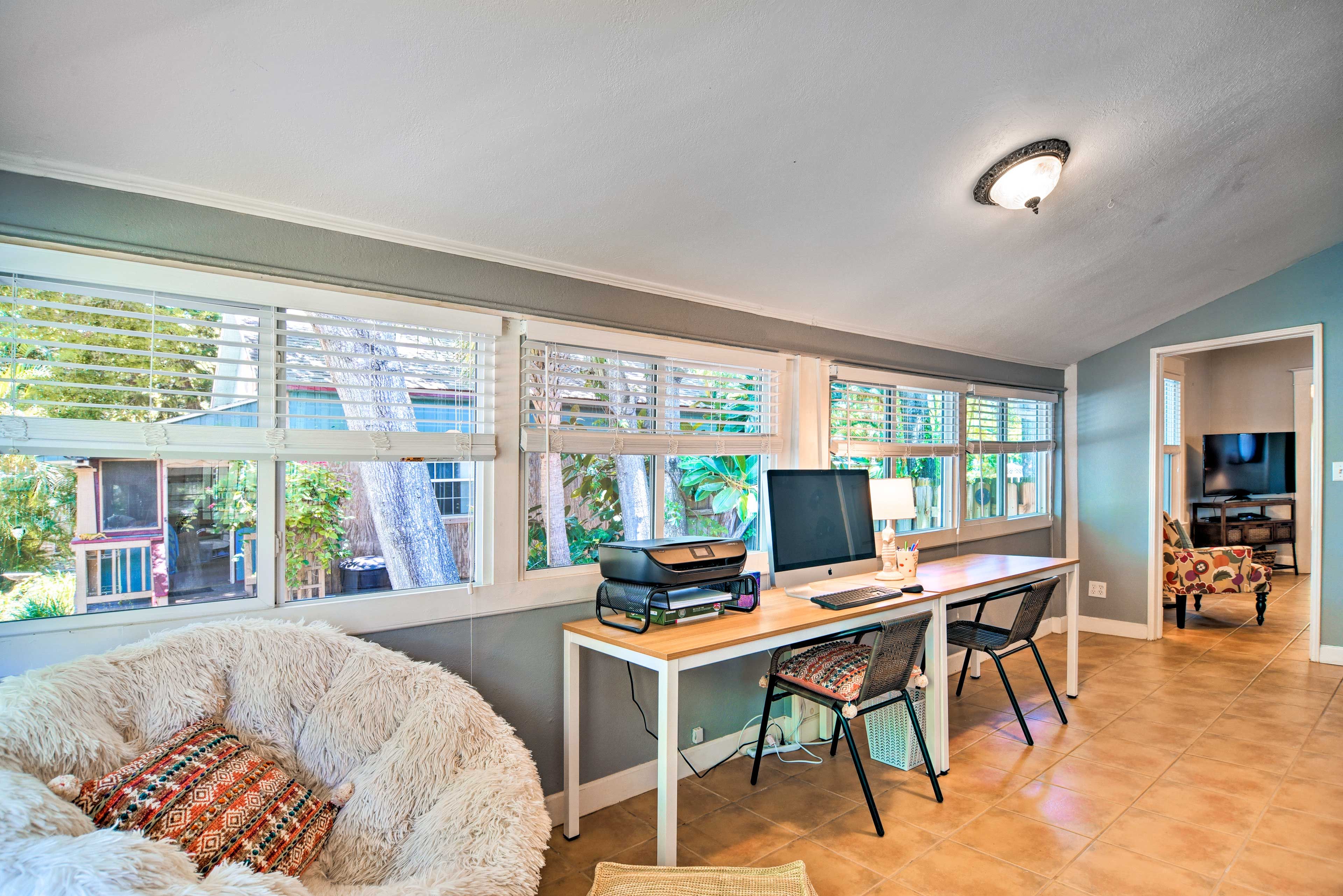 The workstation features an iMac computer and a printer for your convenience.