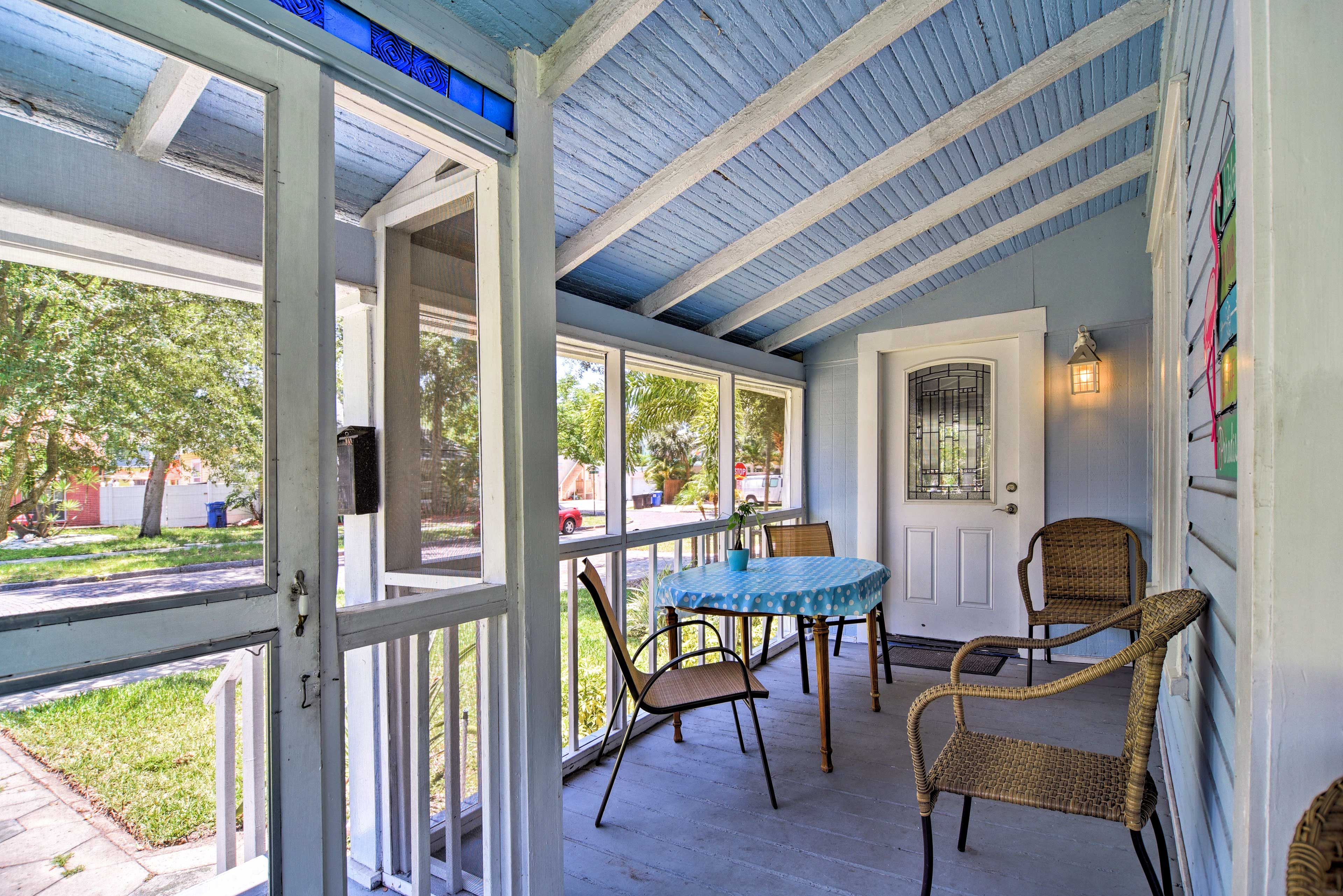 The screened-in porch wraps around 2 sides of the home.