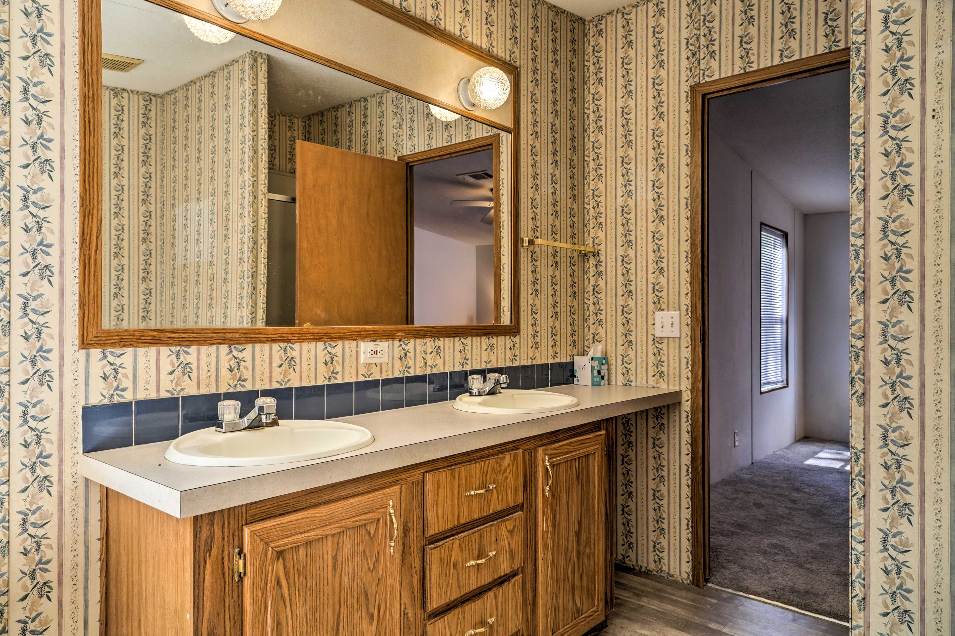 Enjoy ample space to get ready in the main bathroom.