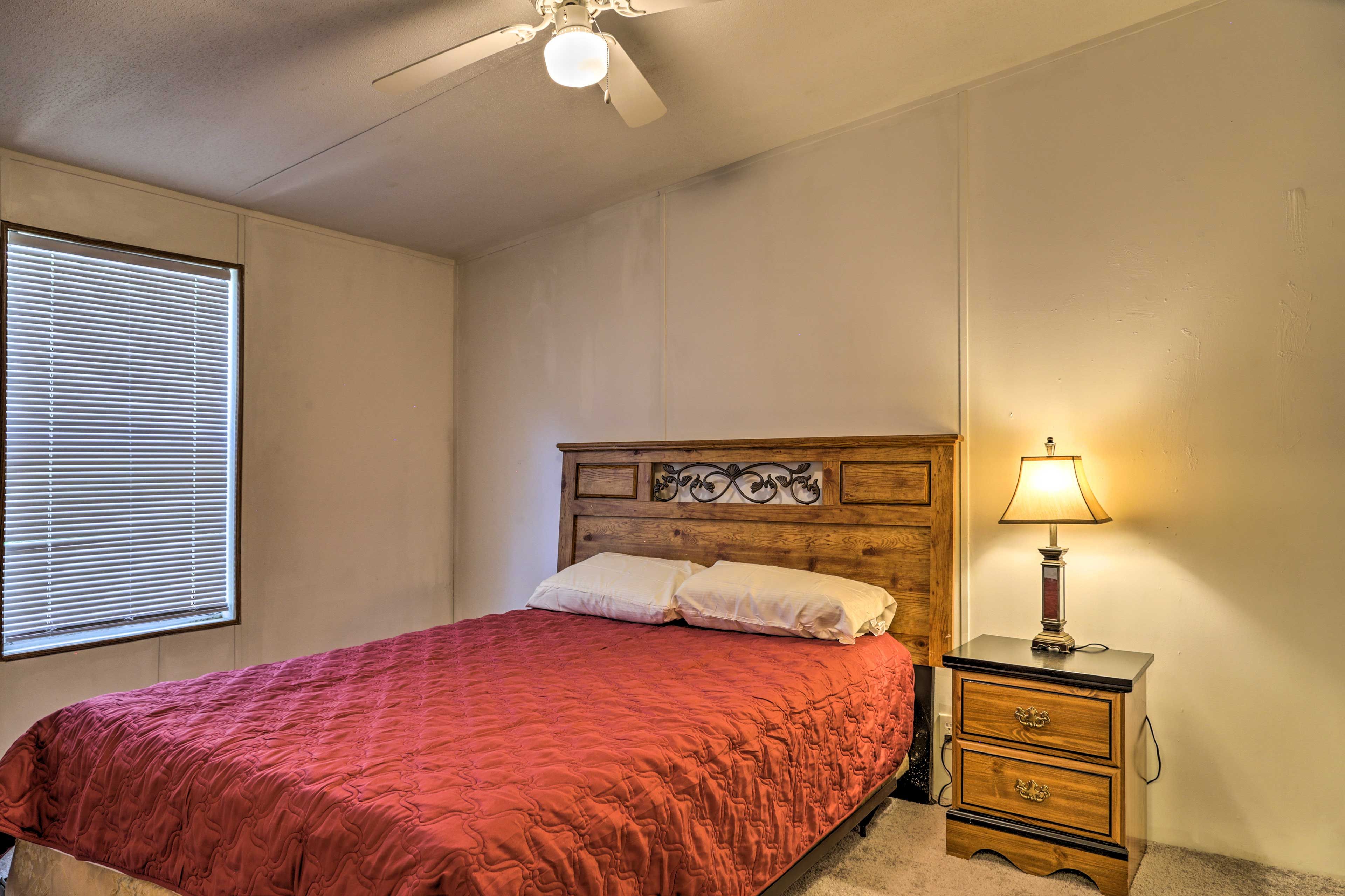 The second bedroom has a plush queen bed.