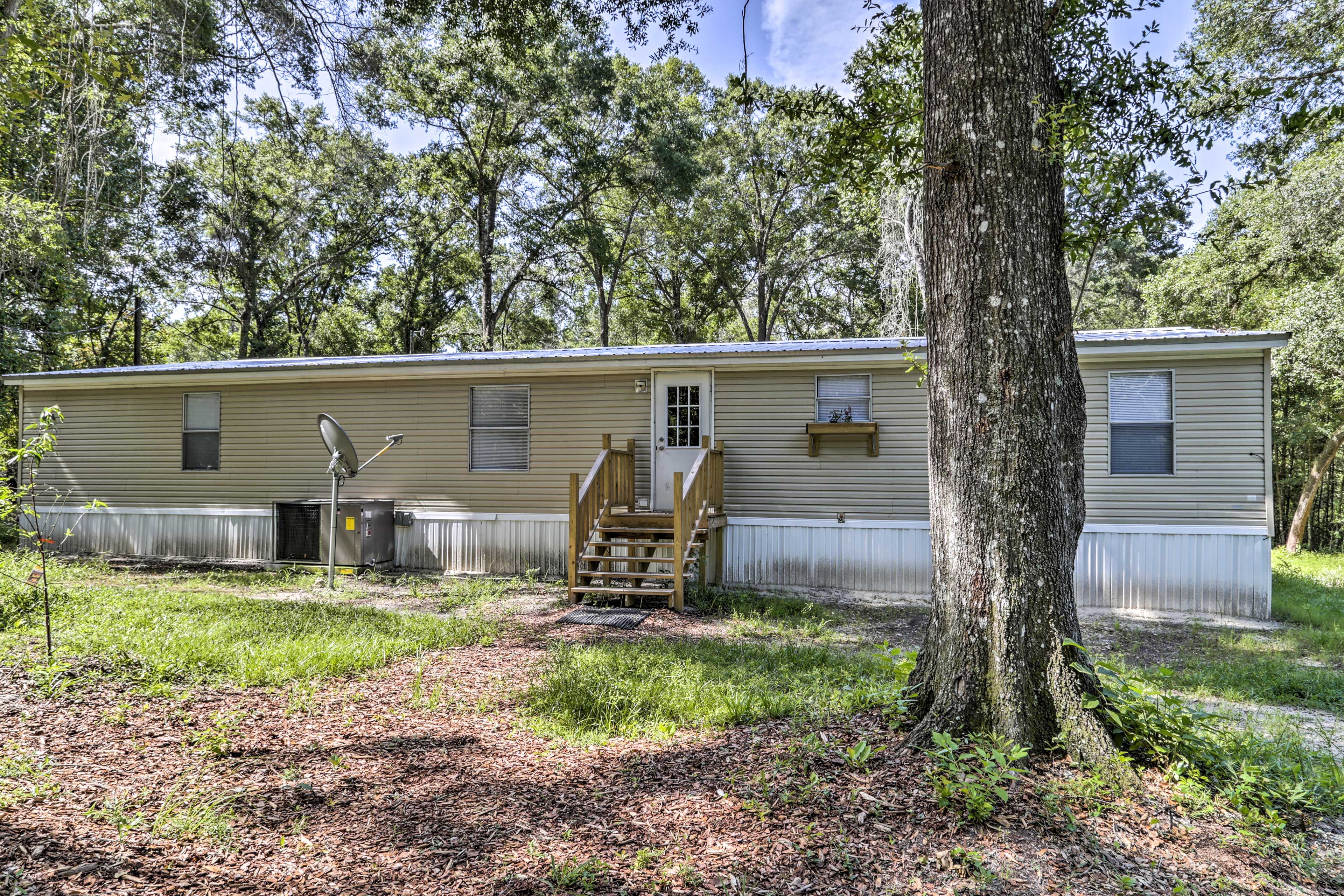 Enjoy the forested  surroundings of this private family-oriented home.