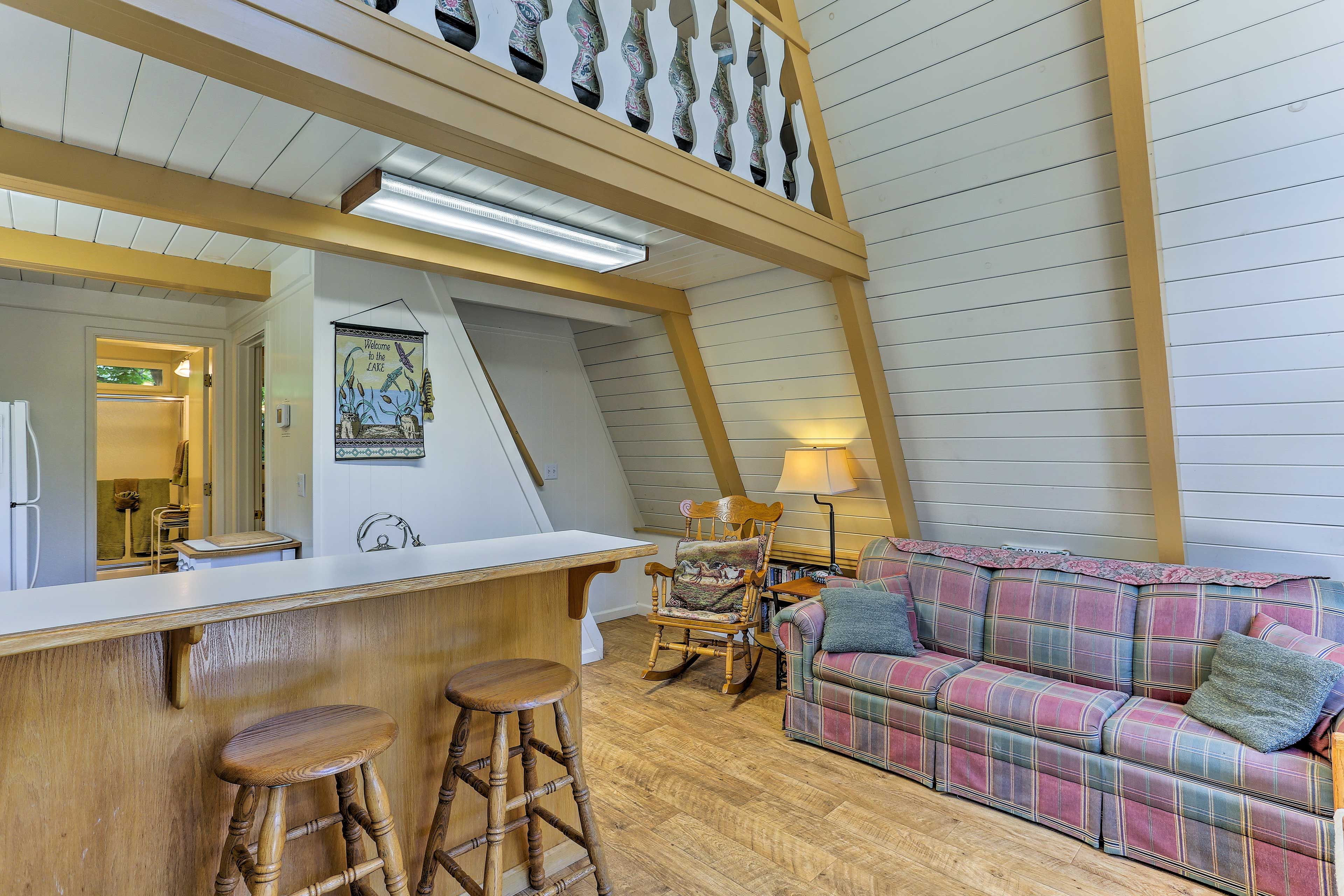 Watch the flat-screen TV while you recline on the cozy couch.