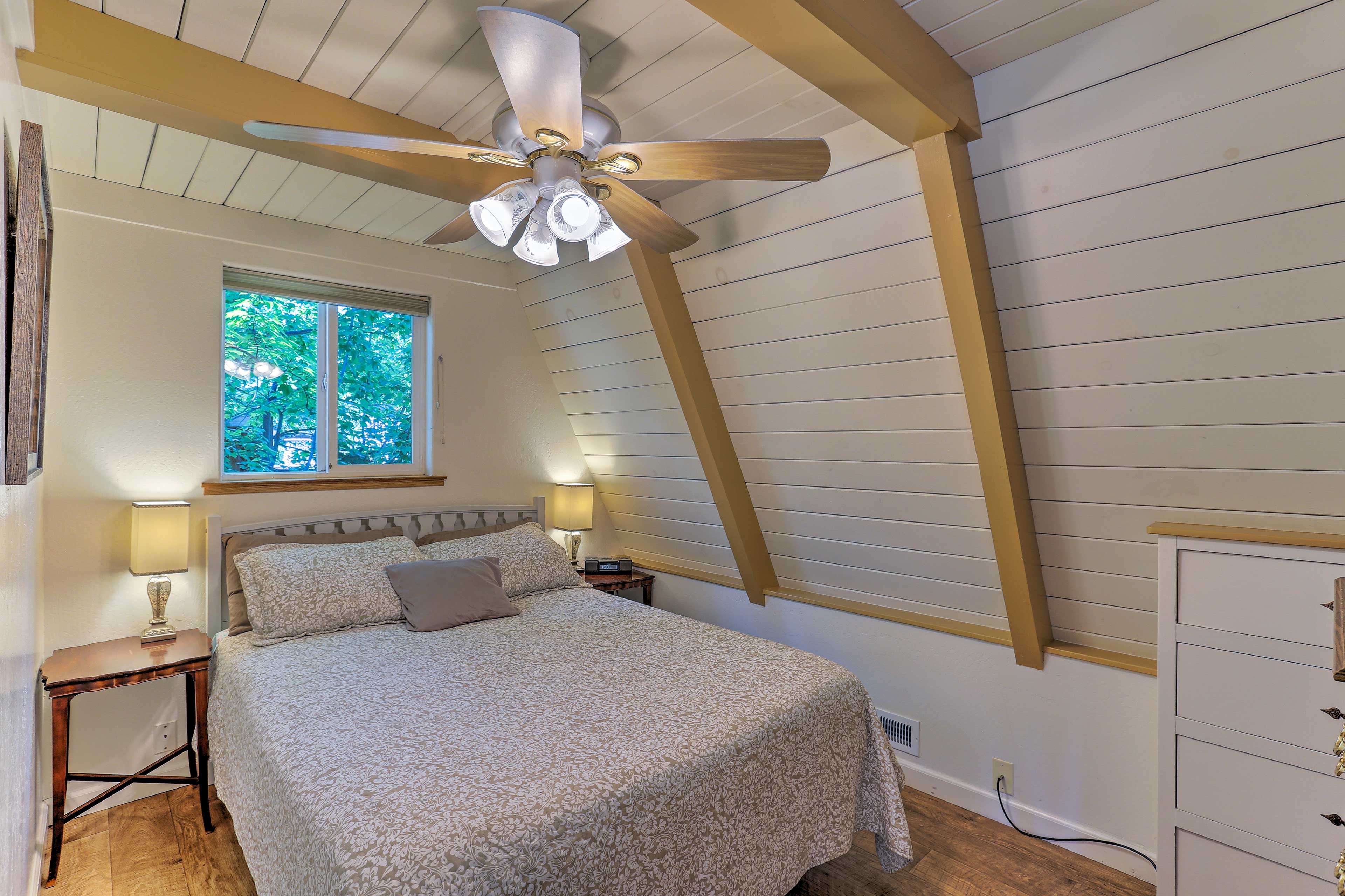 Retire to the bedroom with a queen bed.