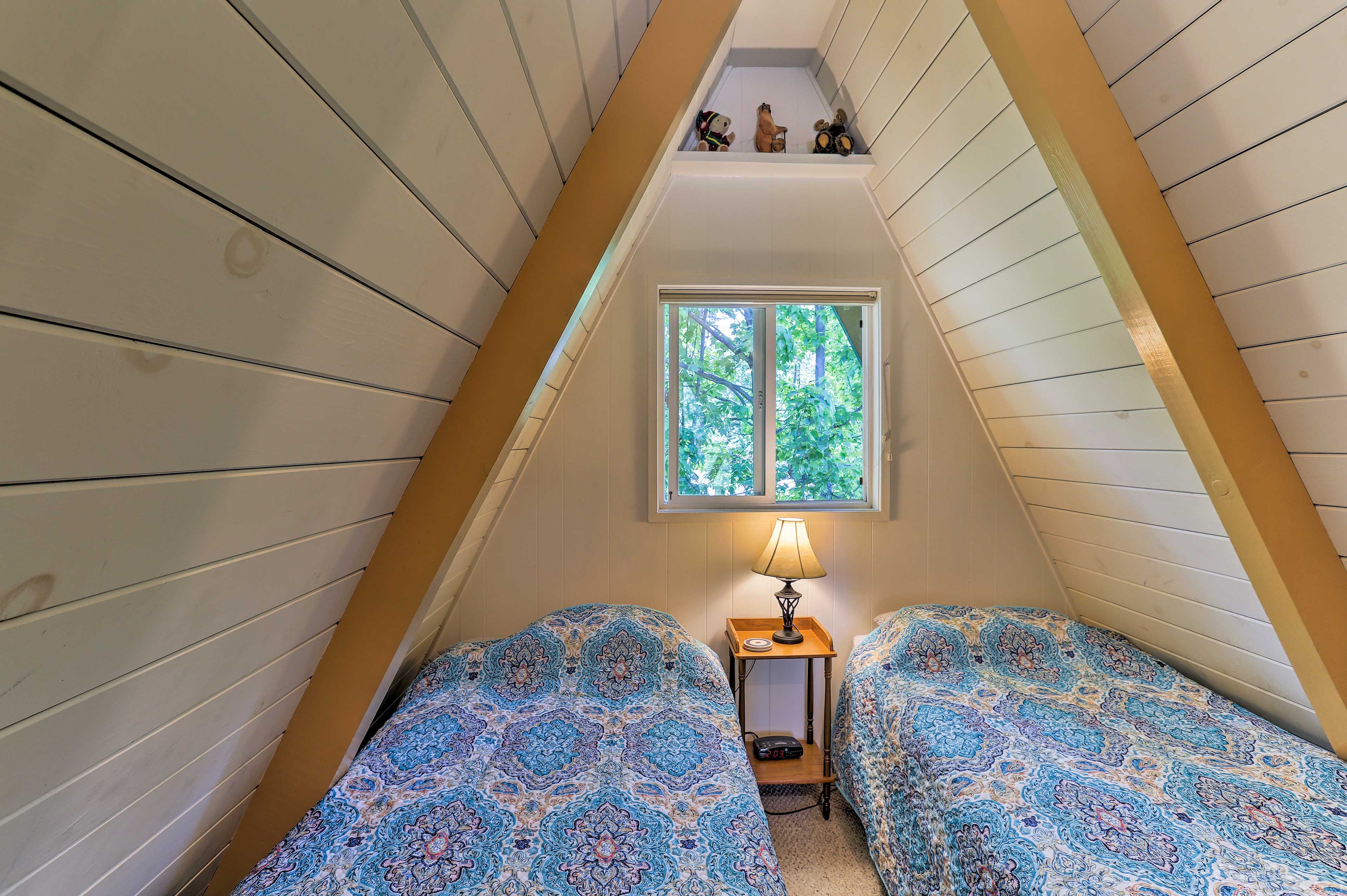 The kids will obsess over this A-frame upstairs room.