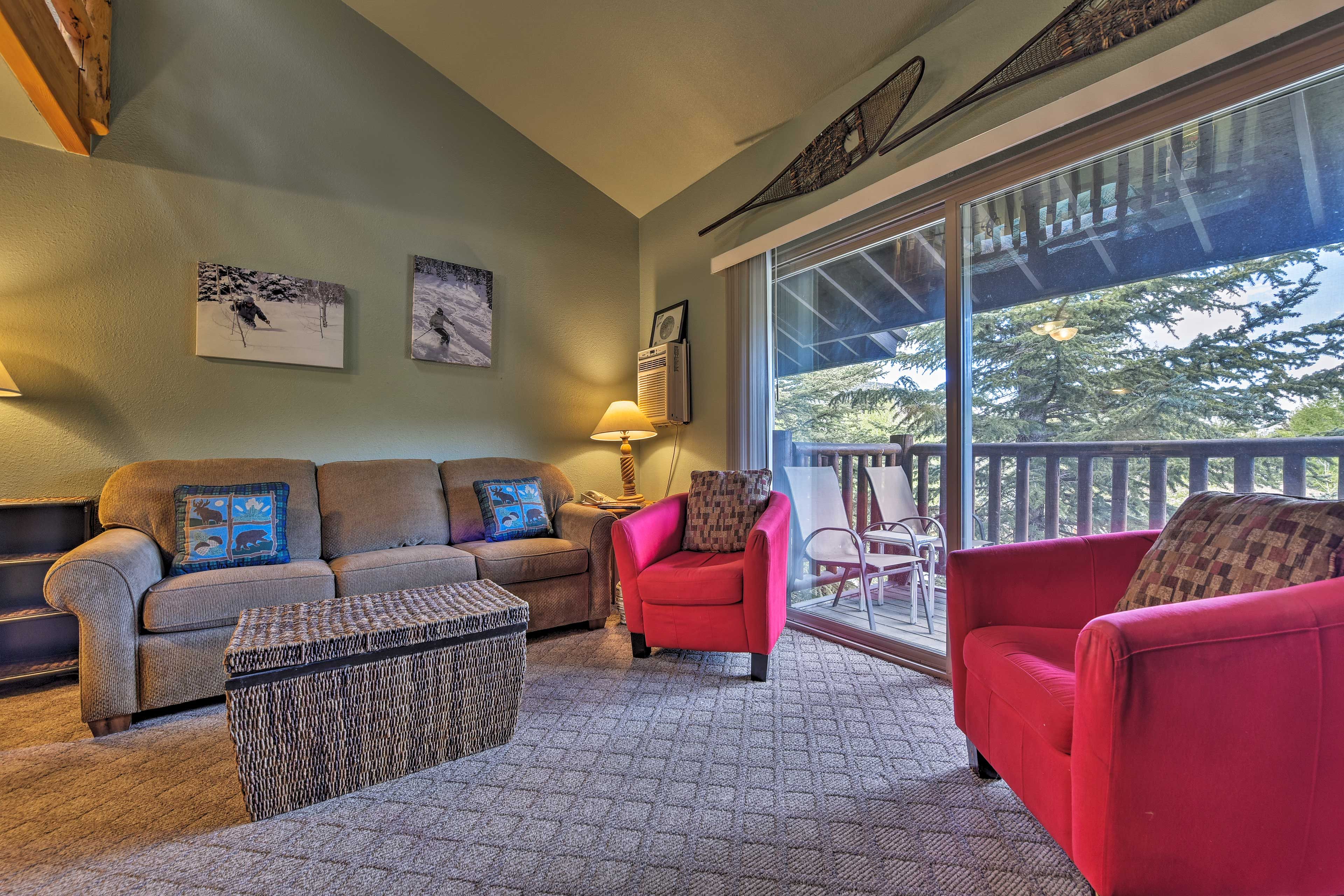 Large glass sliders flood the open living space with natural light.