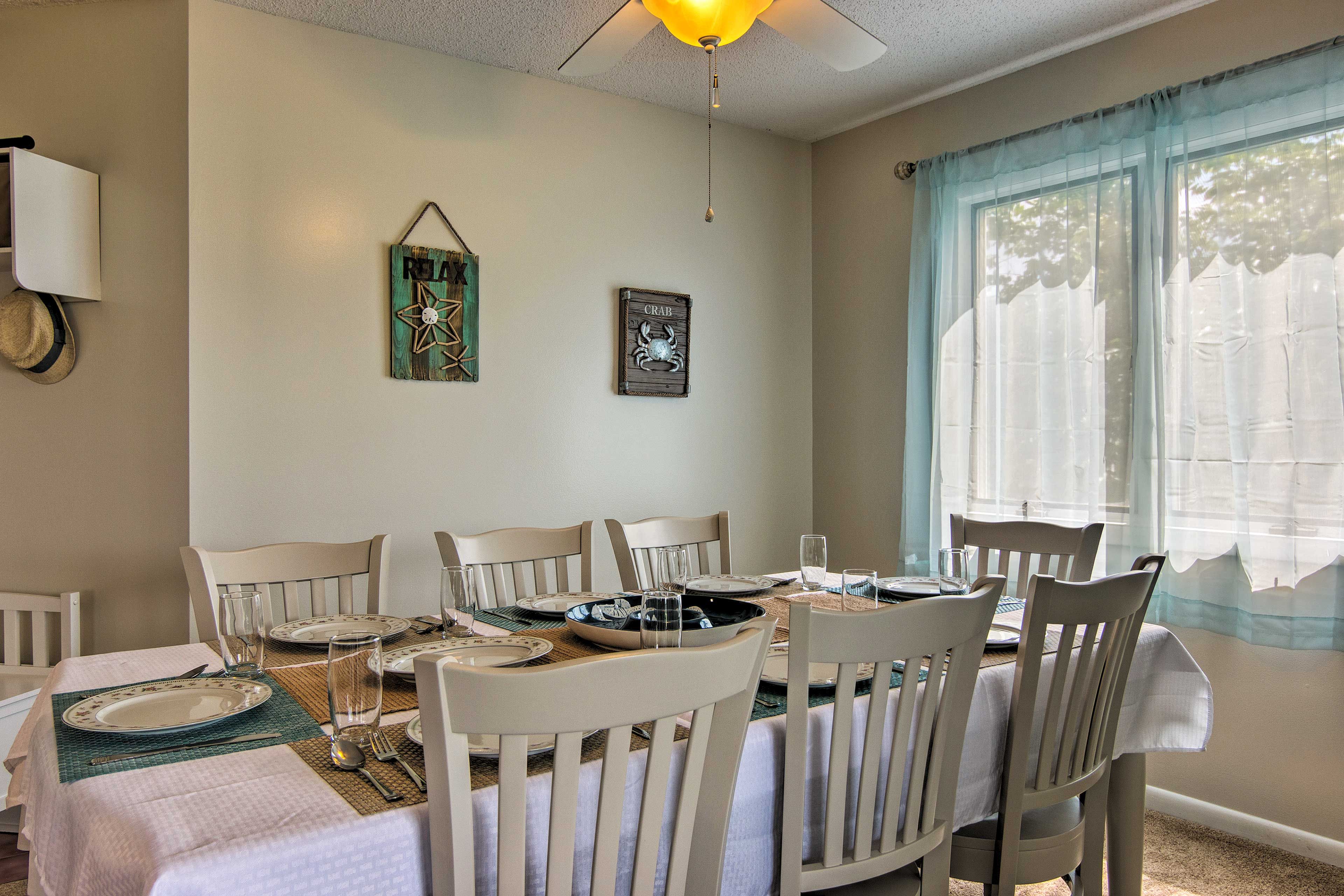 Savor your meals together around the 8-person dining table.