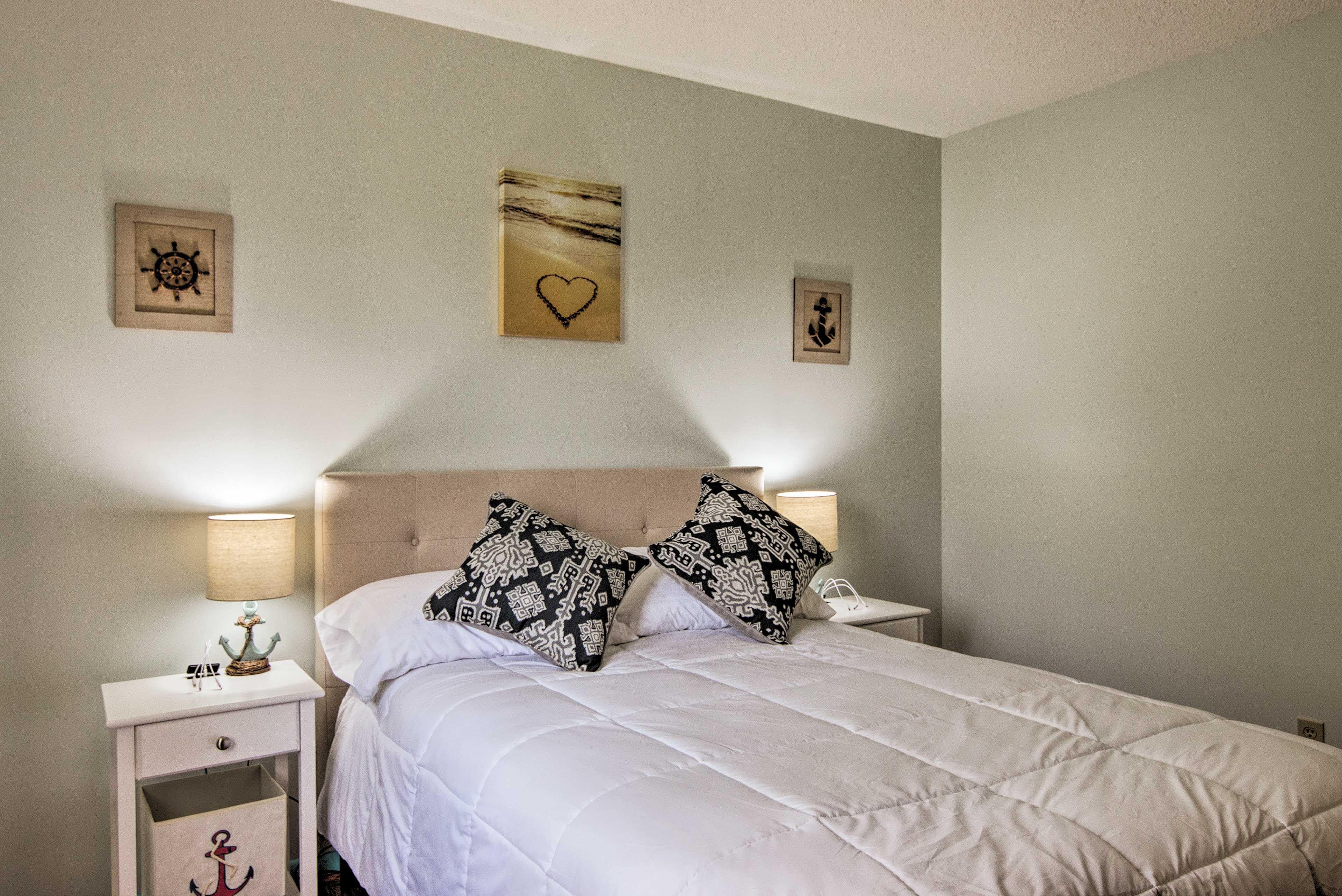 Feel sleep wash over you as you doze off in this serene bedroom.