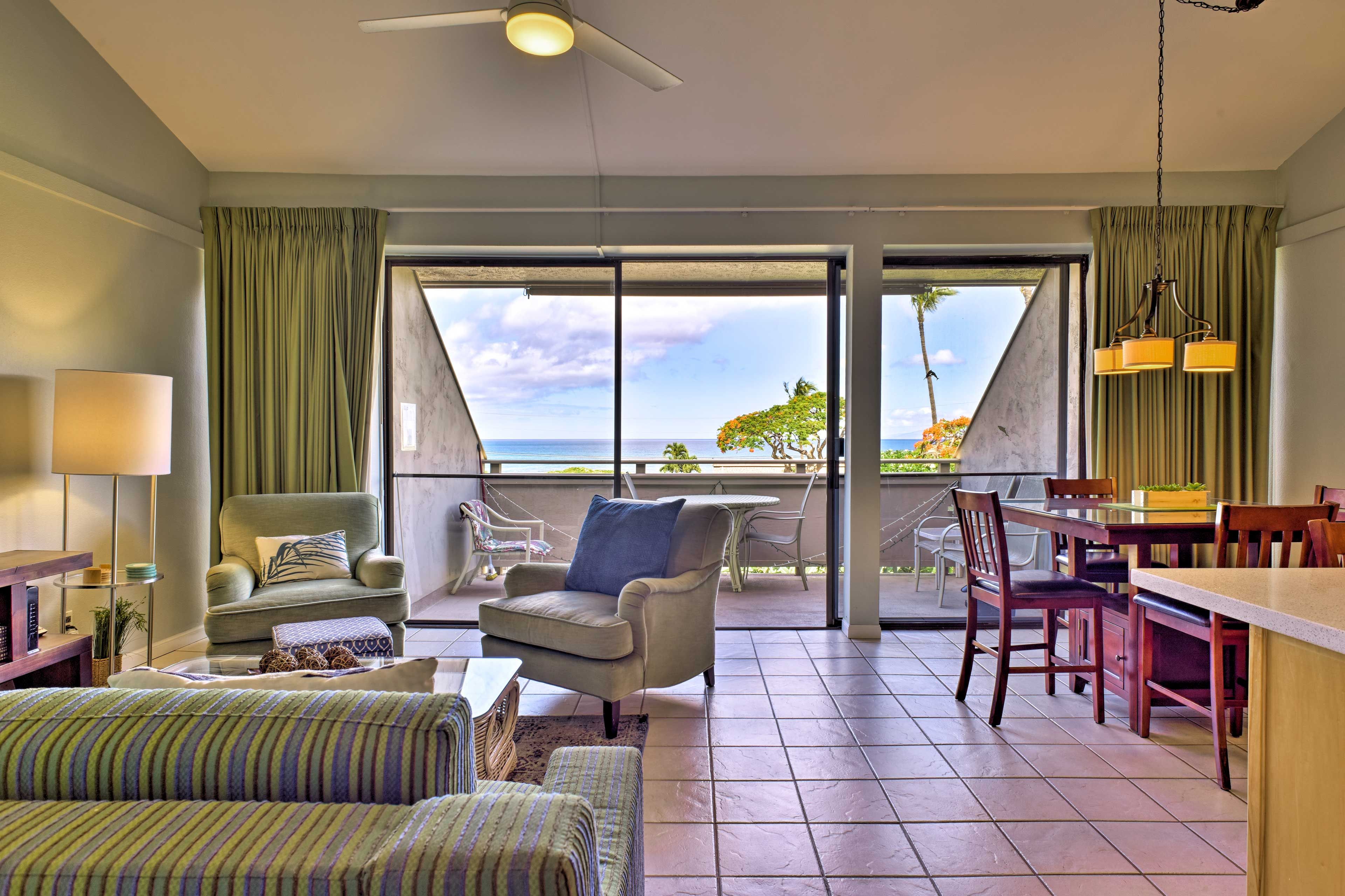 Floor-to-ceiling windows reveal ocean views.