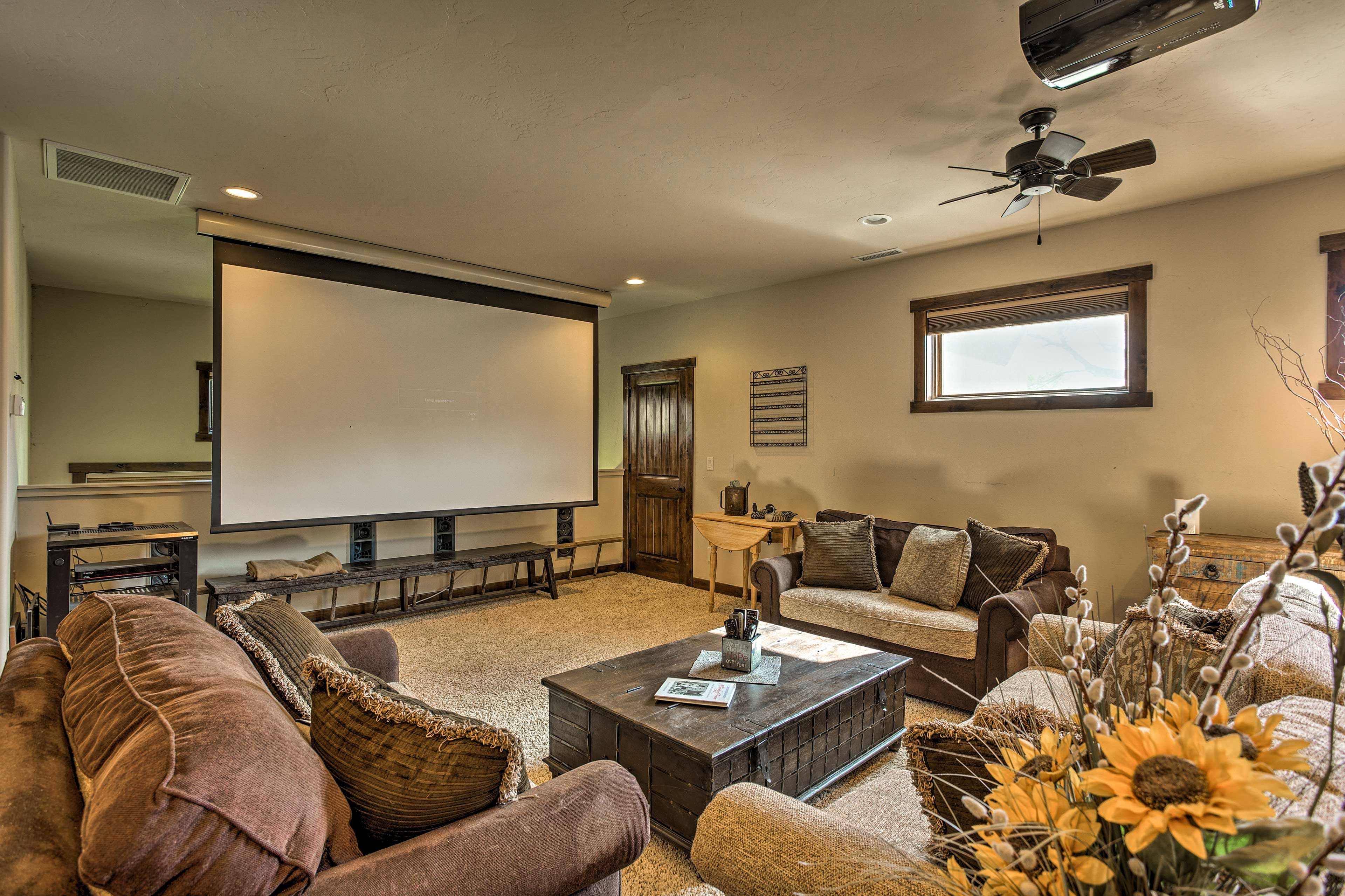 The room features an 11-foot screen and Smart satellite projector.