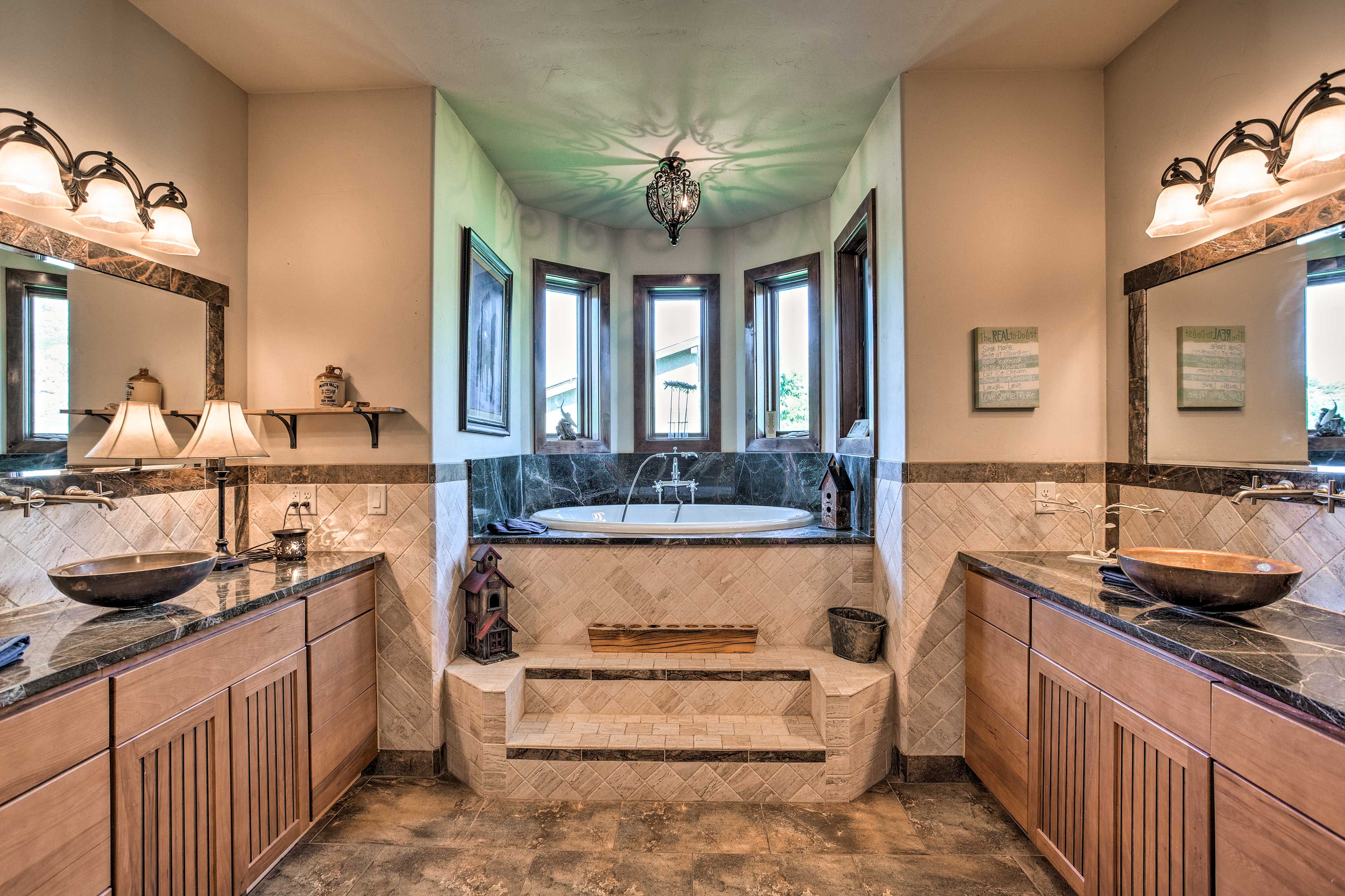 The luxurious en-suite bath boasts a steam shower and separate tub.