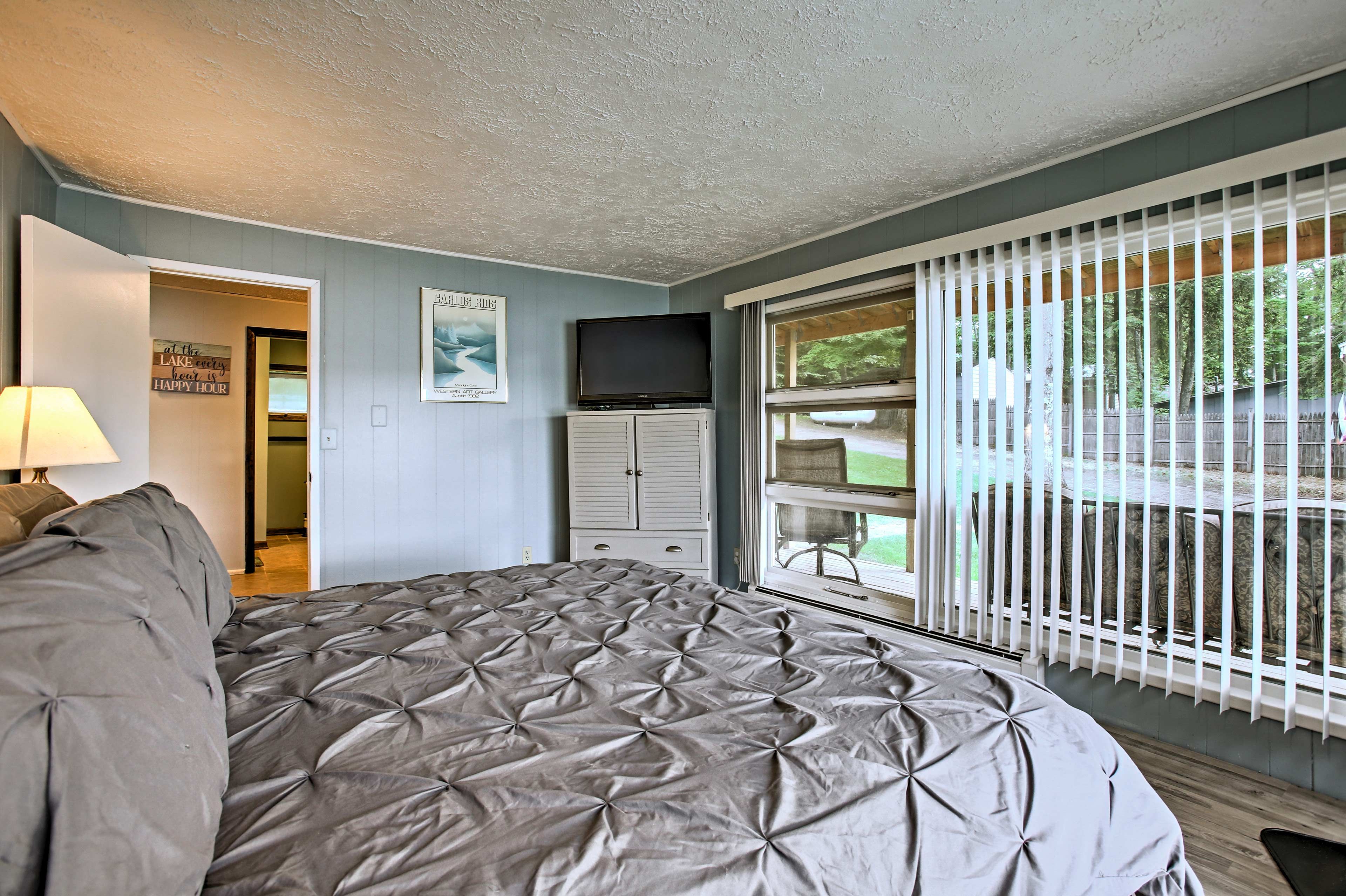 Wake to lake views from the first bedroom king-sized bed.