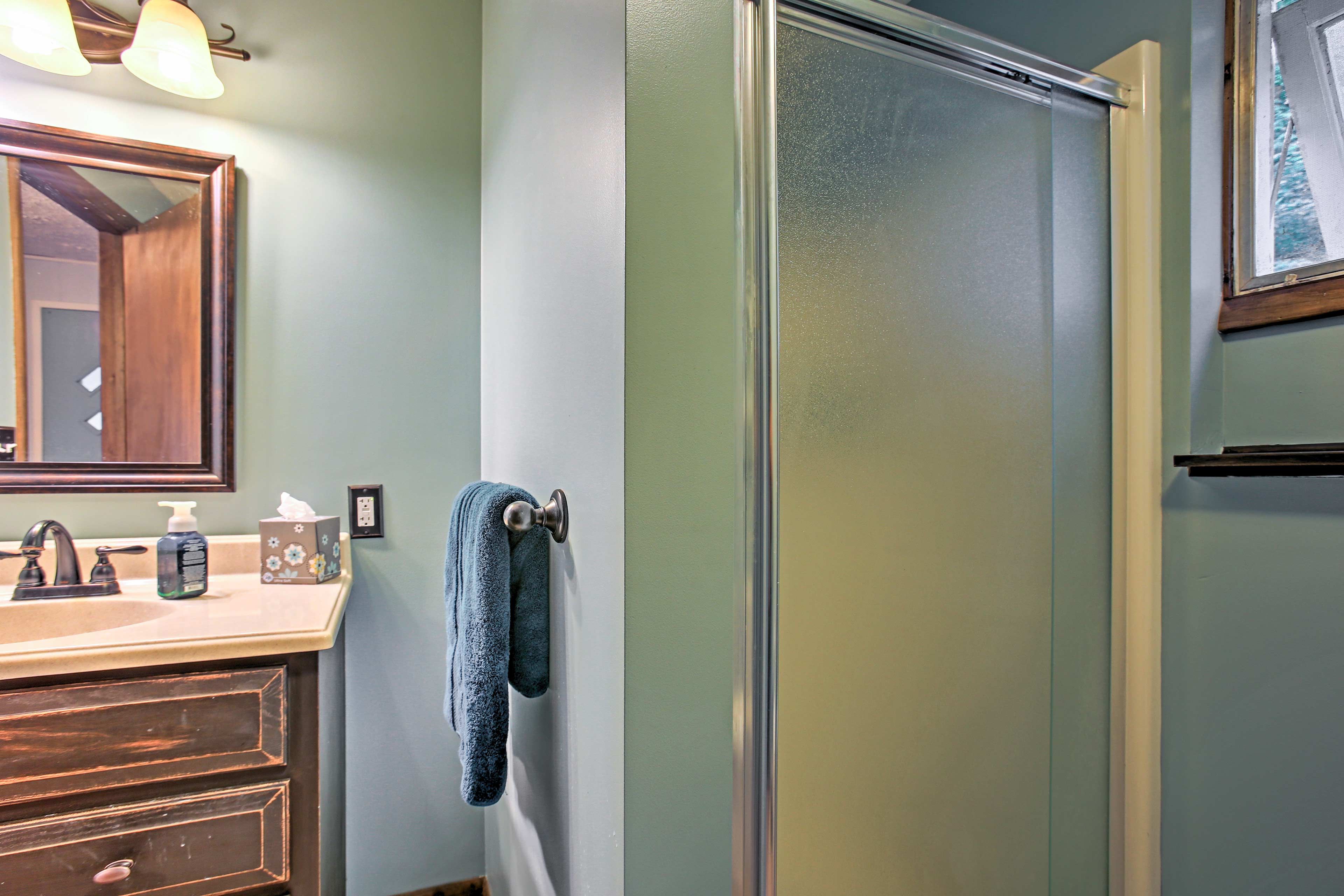 The bathroom boasts a walk-in shower.