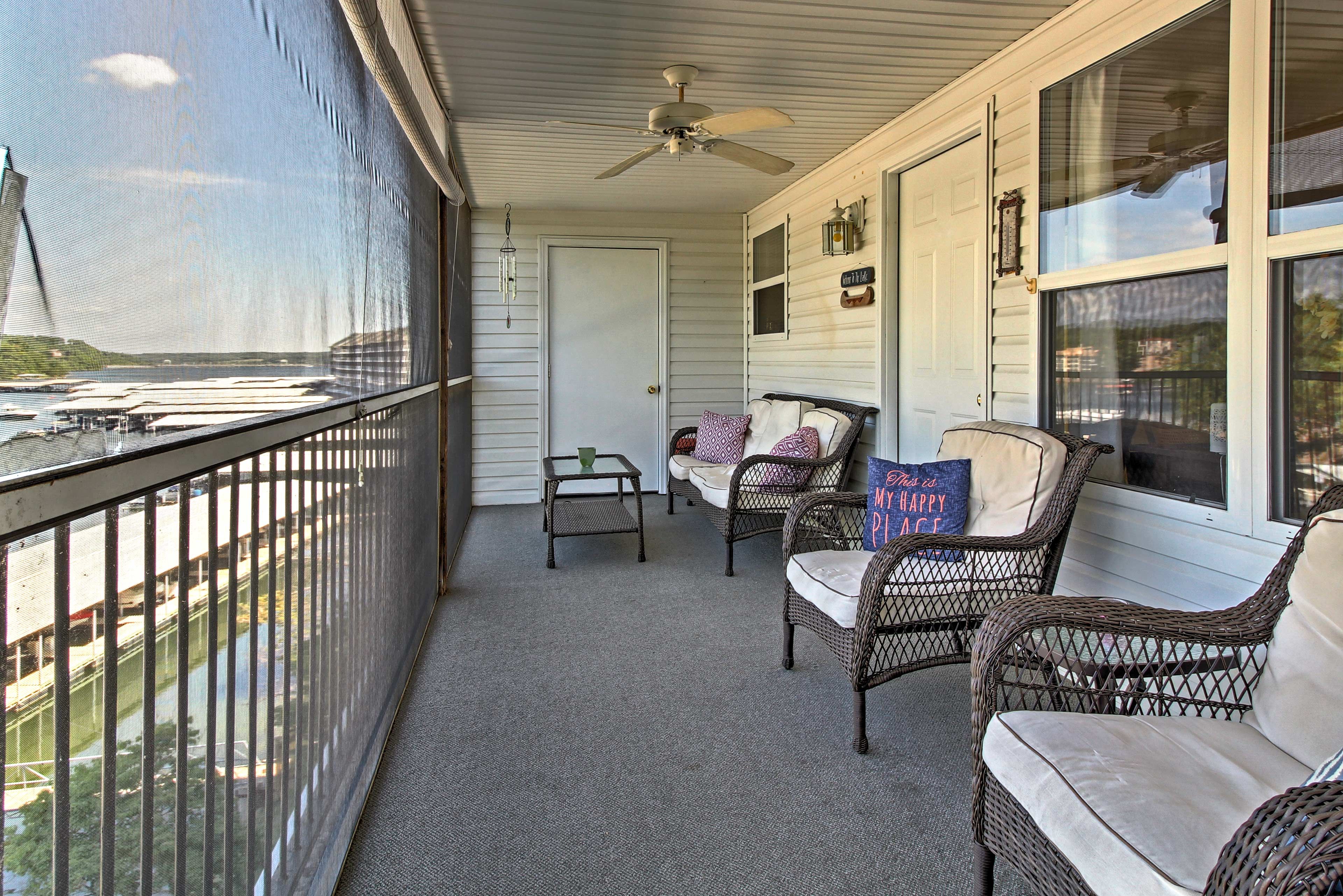 This vacation rental has a covered balcony overlooking the lake.