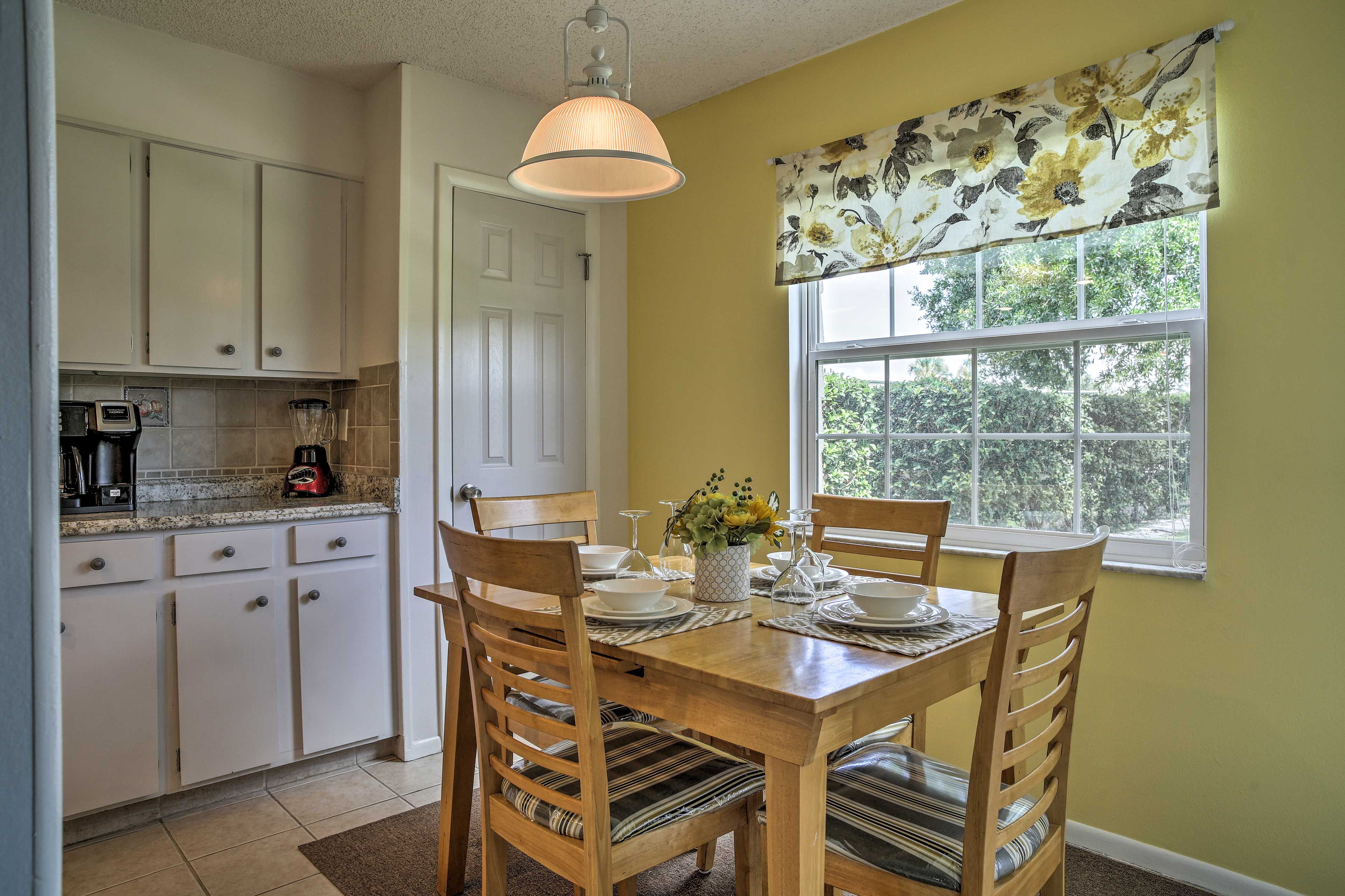 Dine at the 4-person table while discussing the day's highlights.