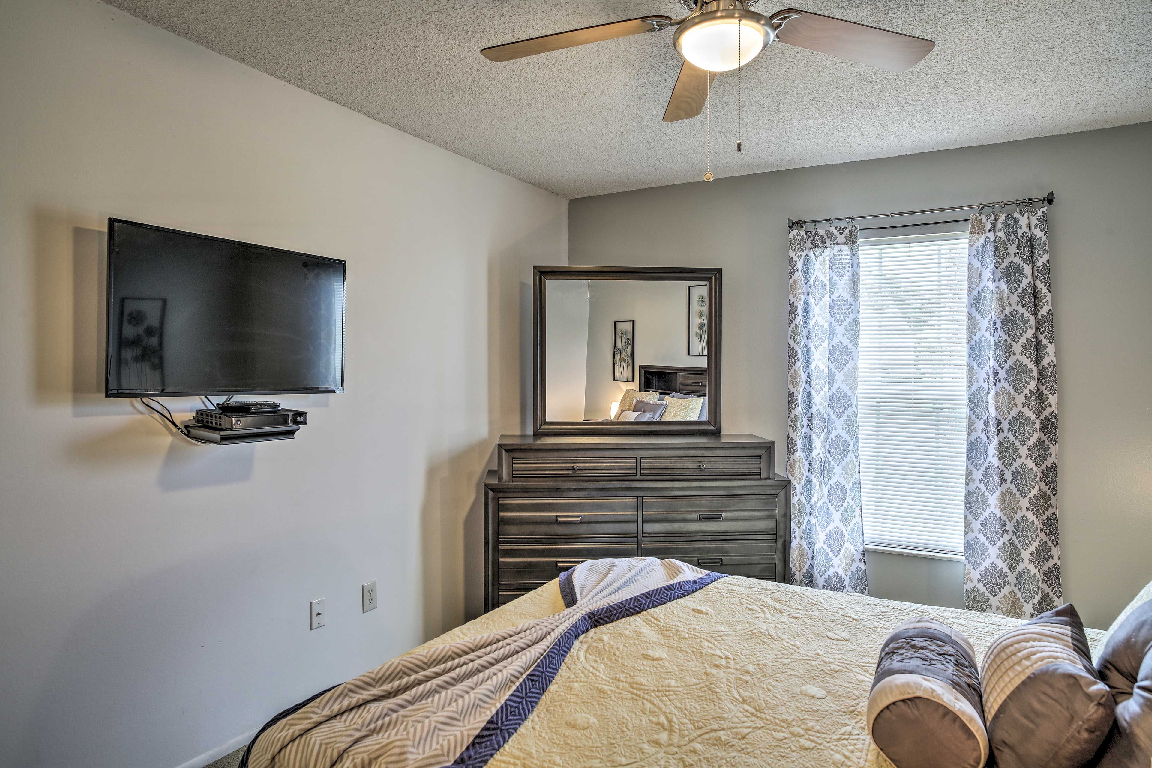 Slip under the covers of the queen bed in the first bedroom.