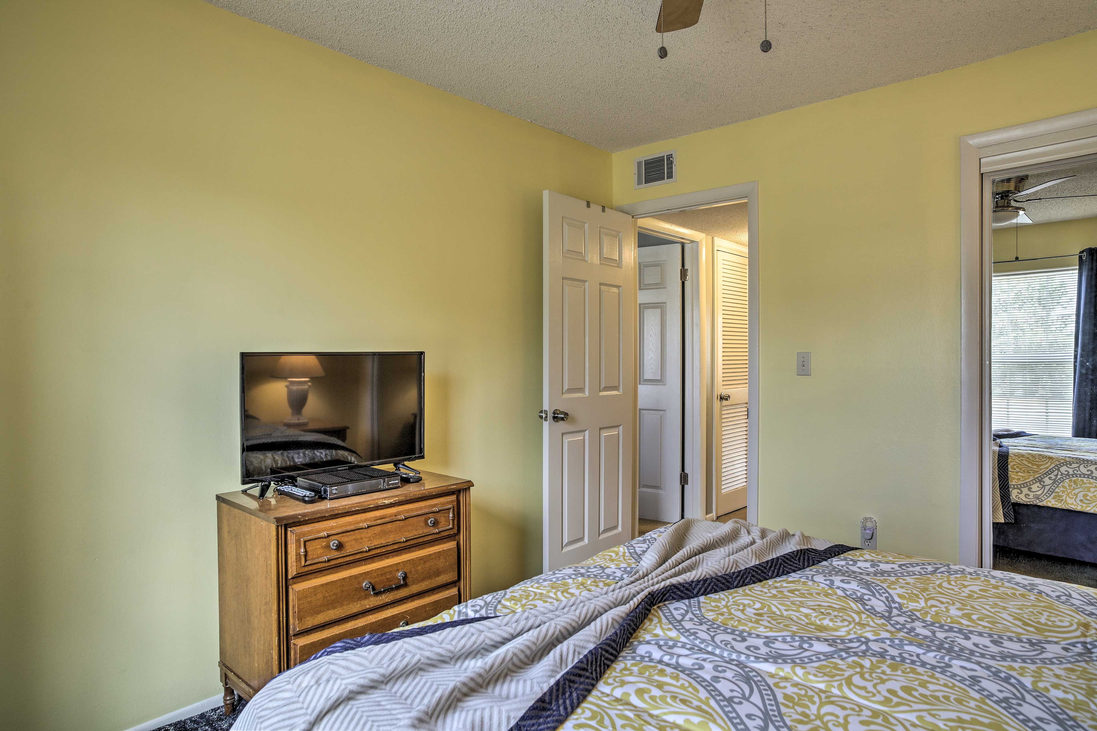 Another HDTV is provided in this queen bedroom.