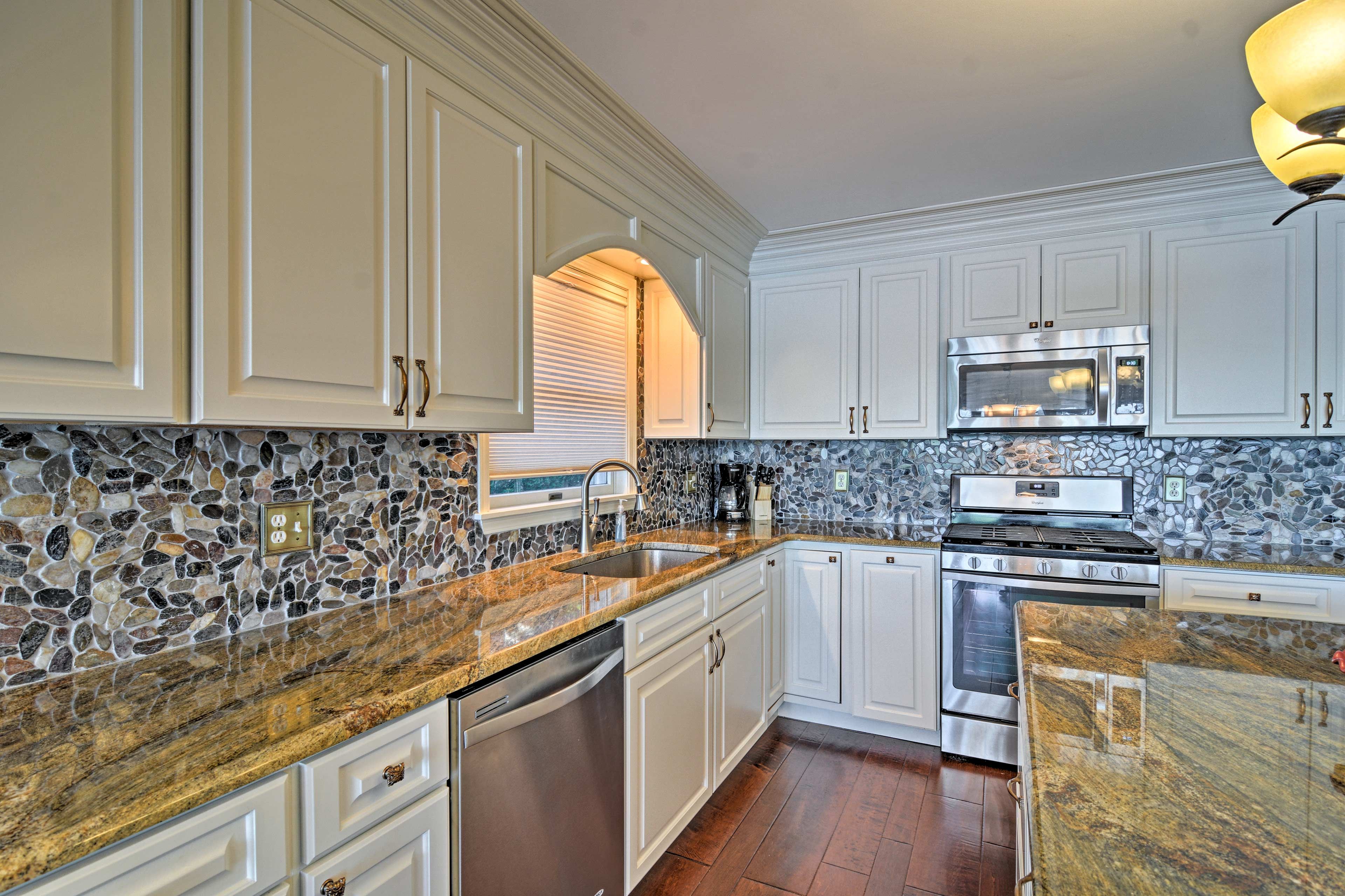 The fully equipped kitchen offers stainless steel appliances.