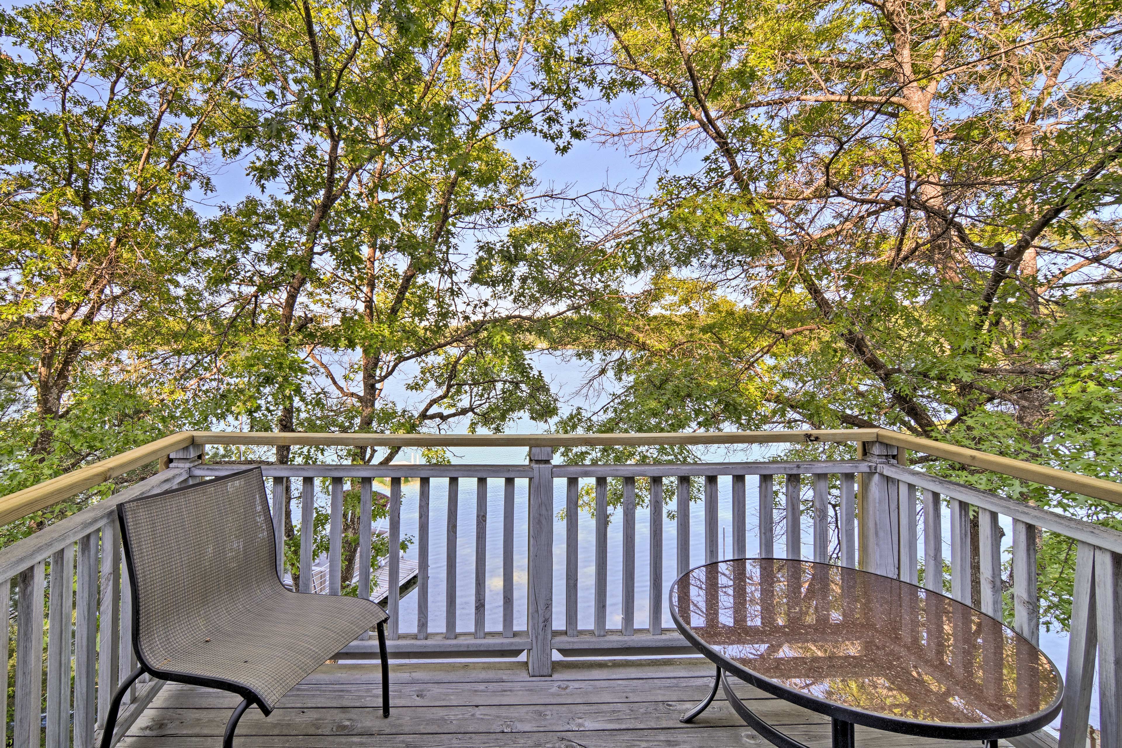 This bedroom has a private balcony overlooking the lake.