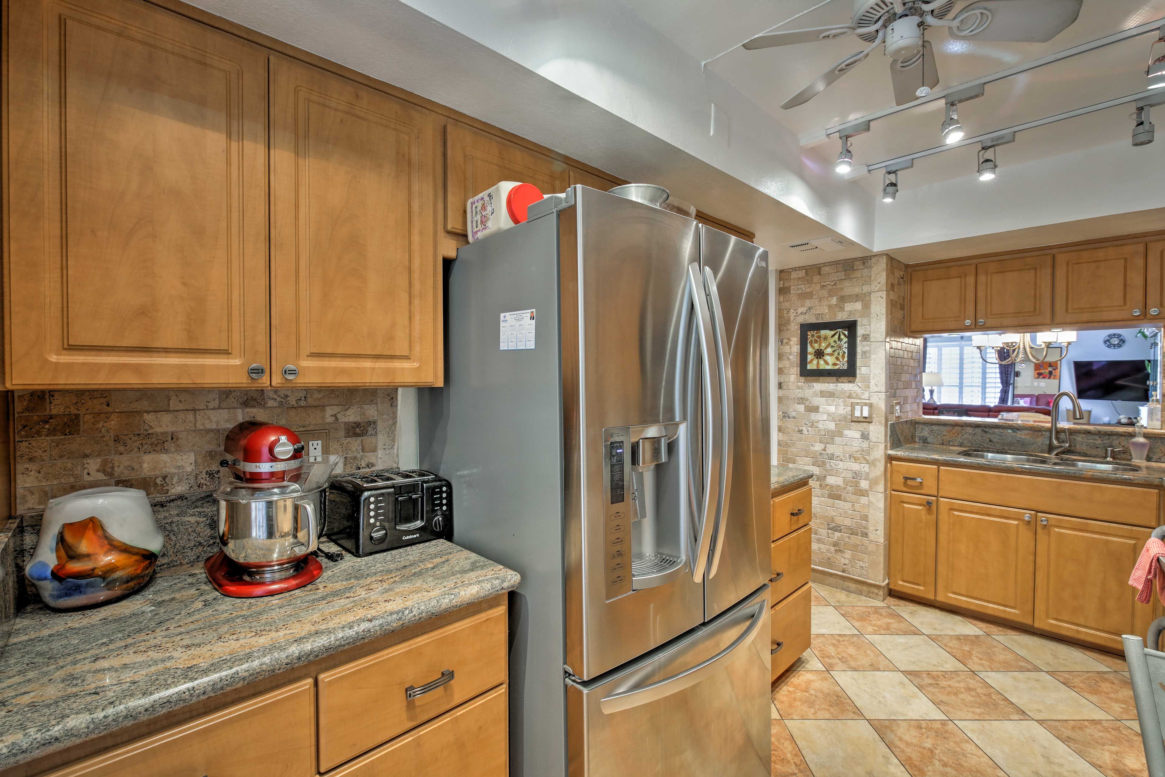 Stainless steel appliances highlight this fully equipped kitchen.