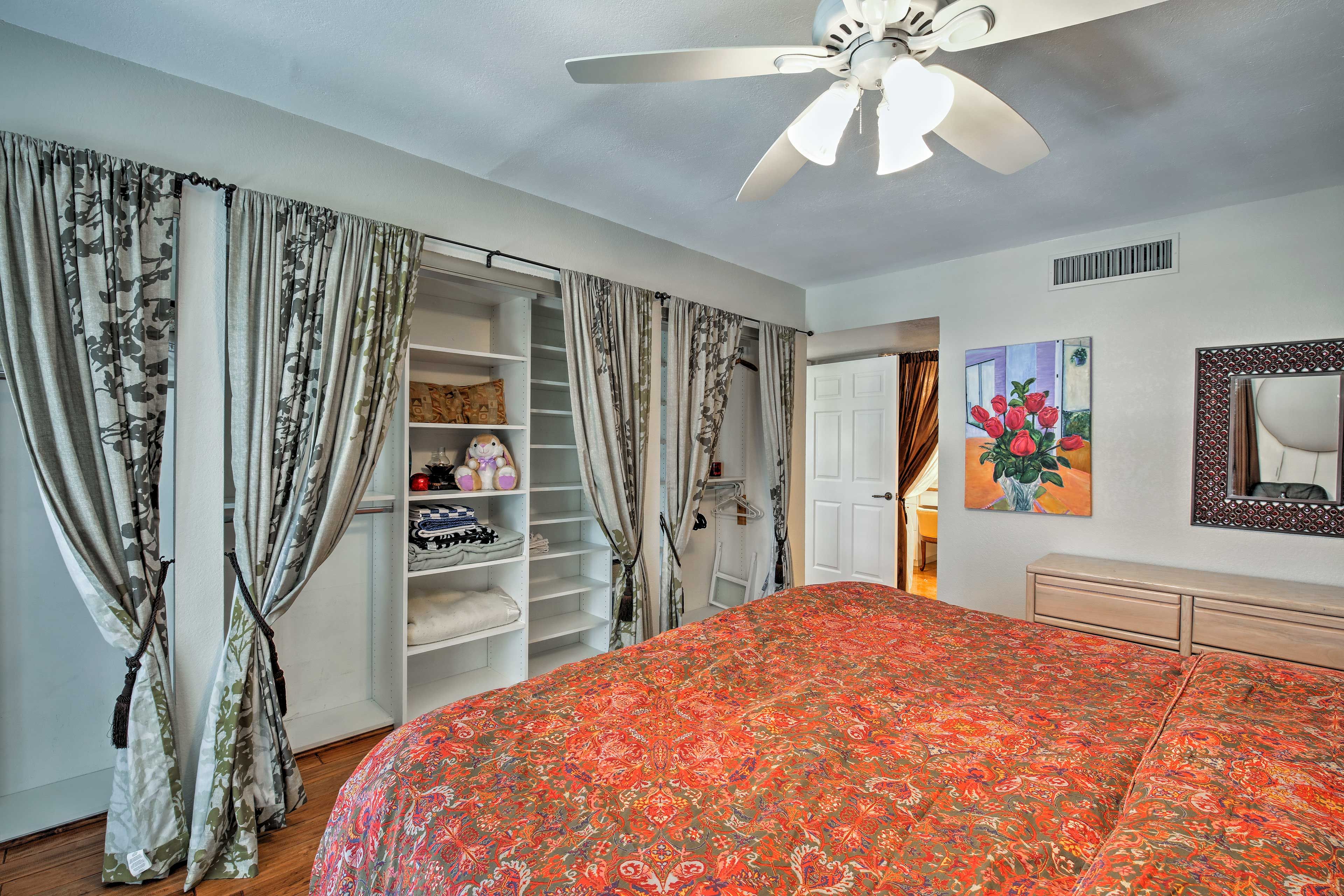 The main bedroom boasts a king bed and ample closet storage.