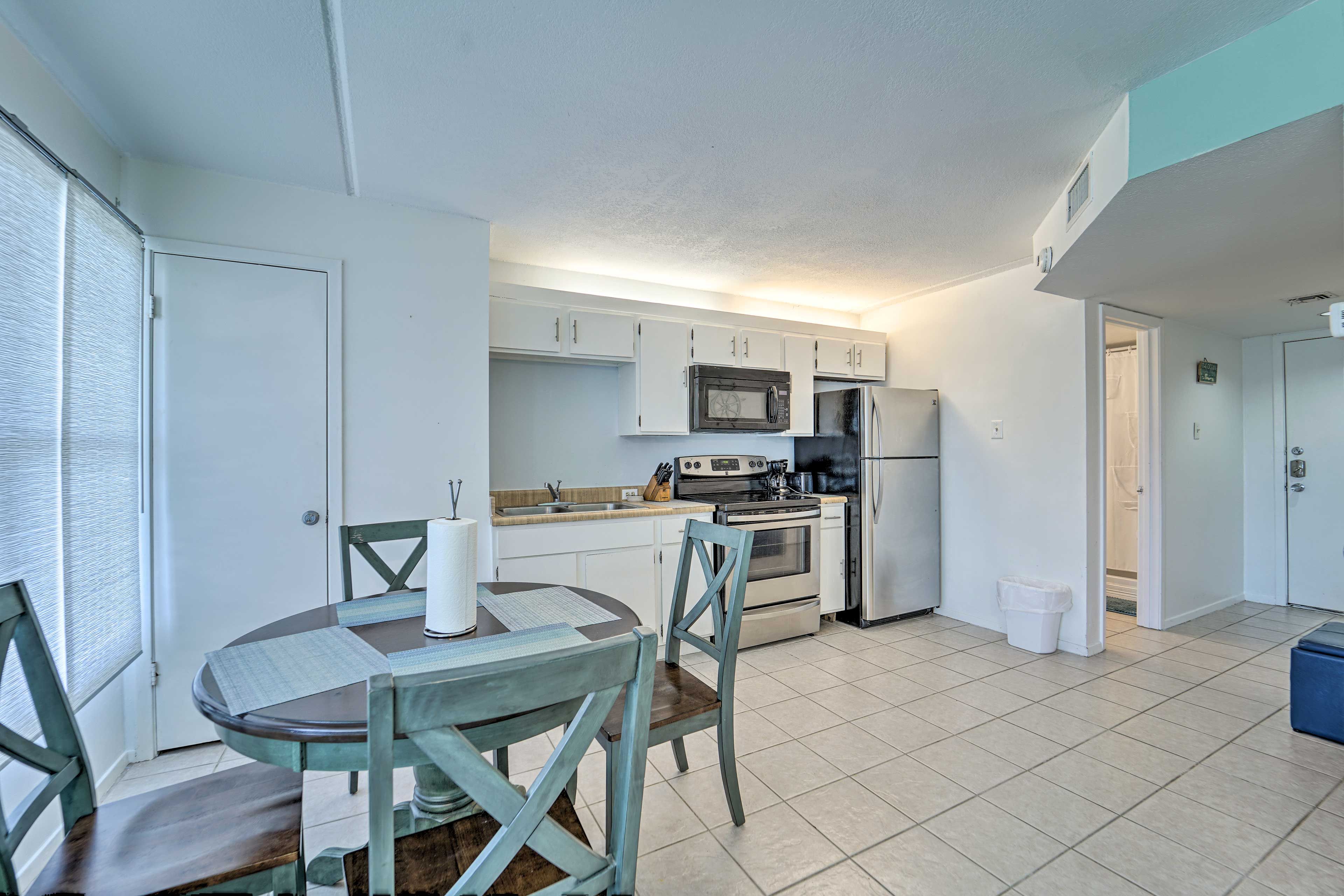 Stainless steel appliances and ample cookware let you whip up meals with ease.