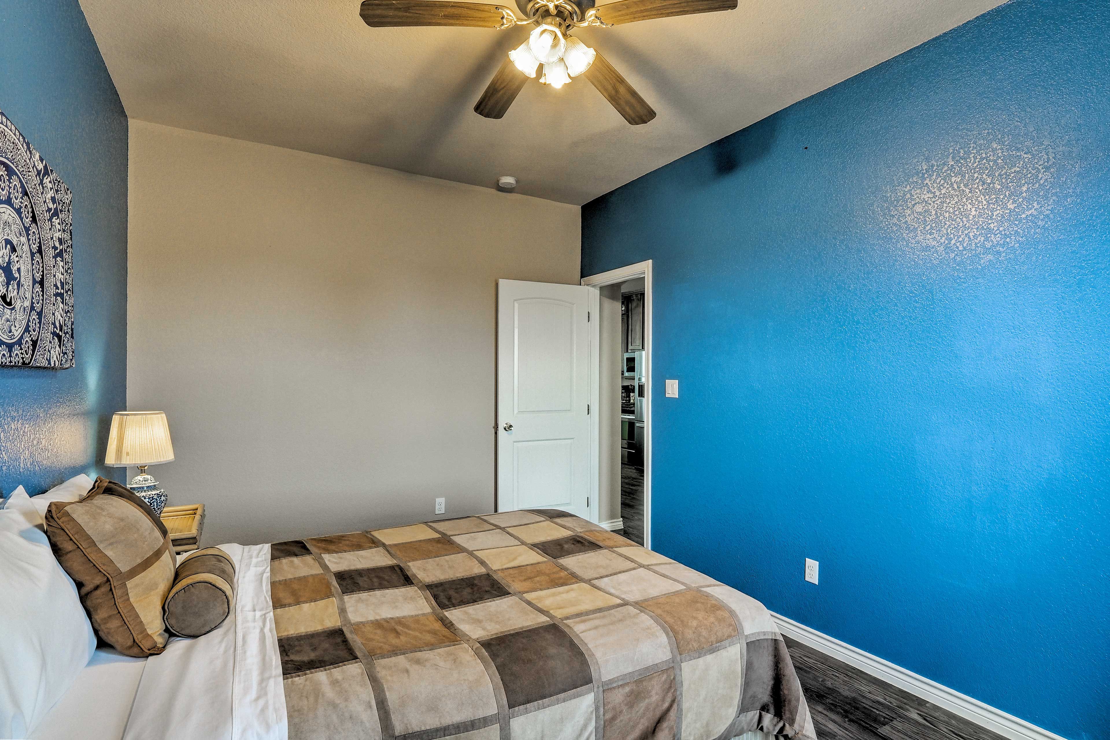 The second bedroom is equipped with a queen bed.
