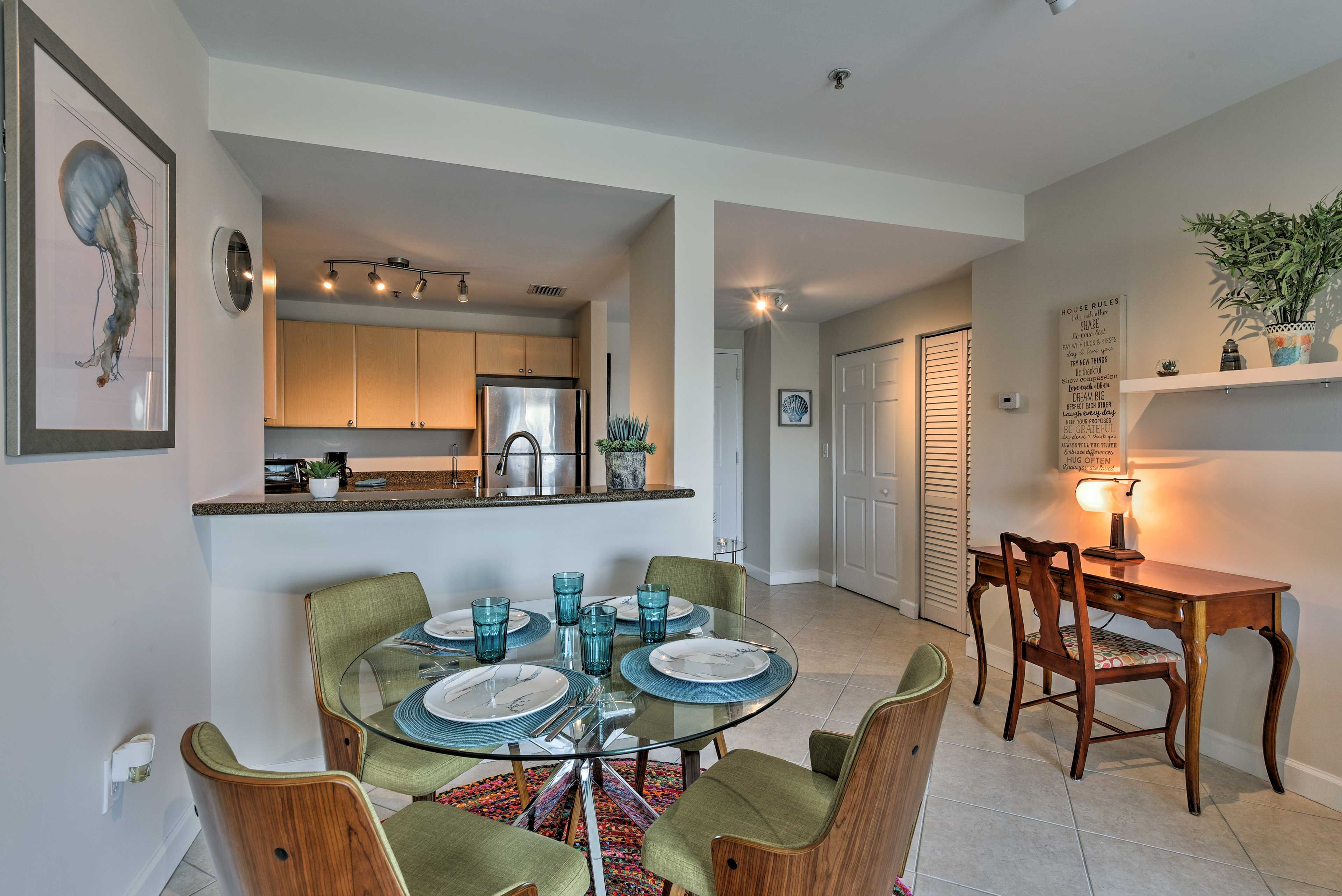 Discuss plans for the day over breakfast at the 4-person dining table.